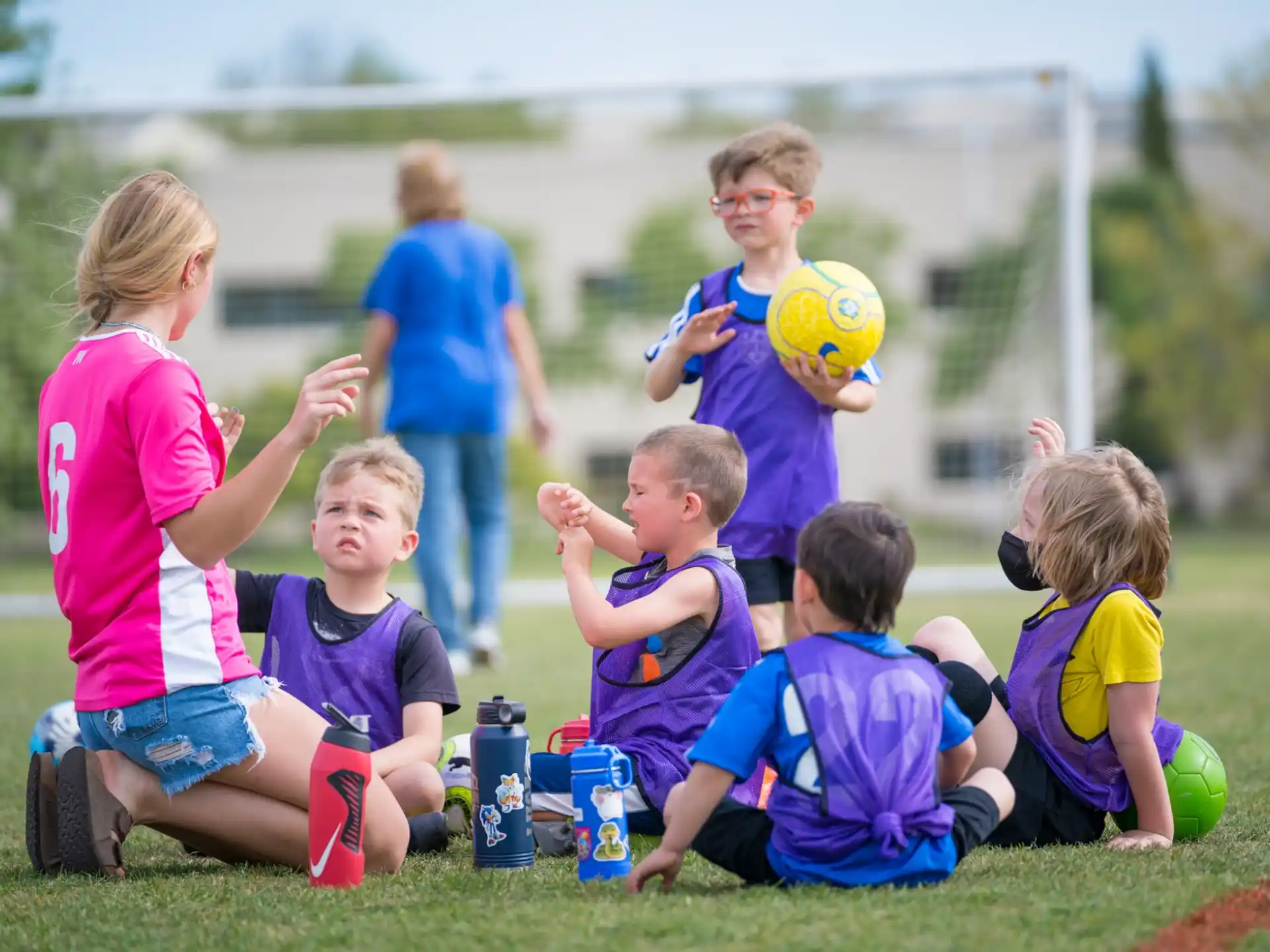 a group of kids playing with a ball