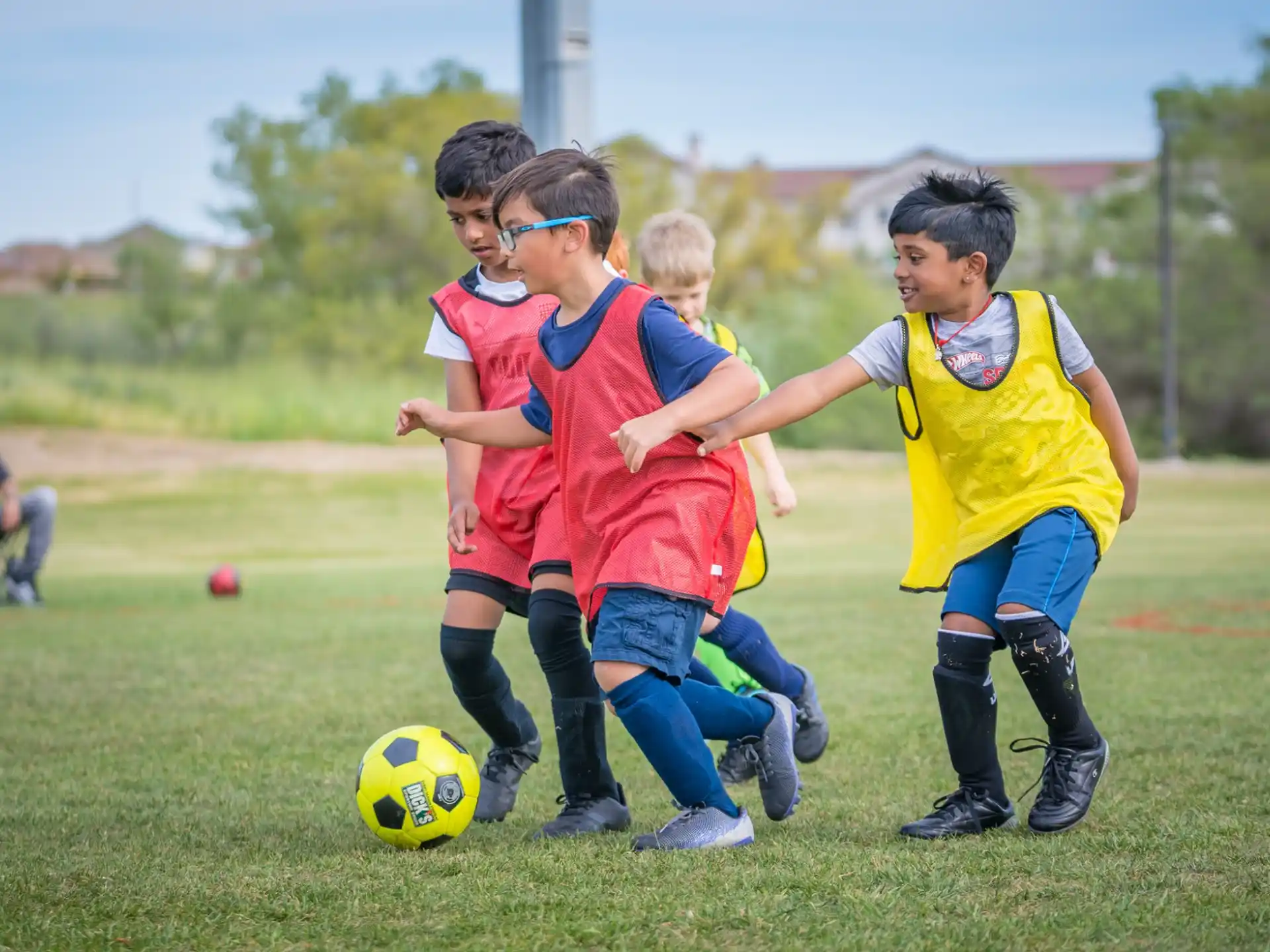 kids playing football on a field