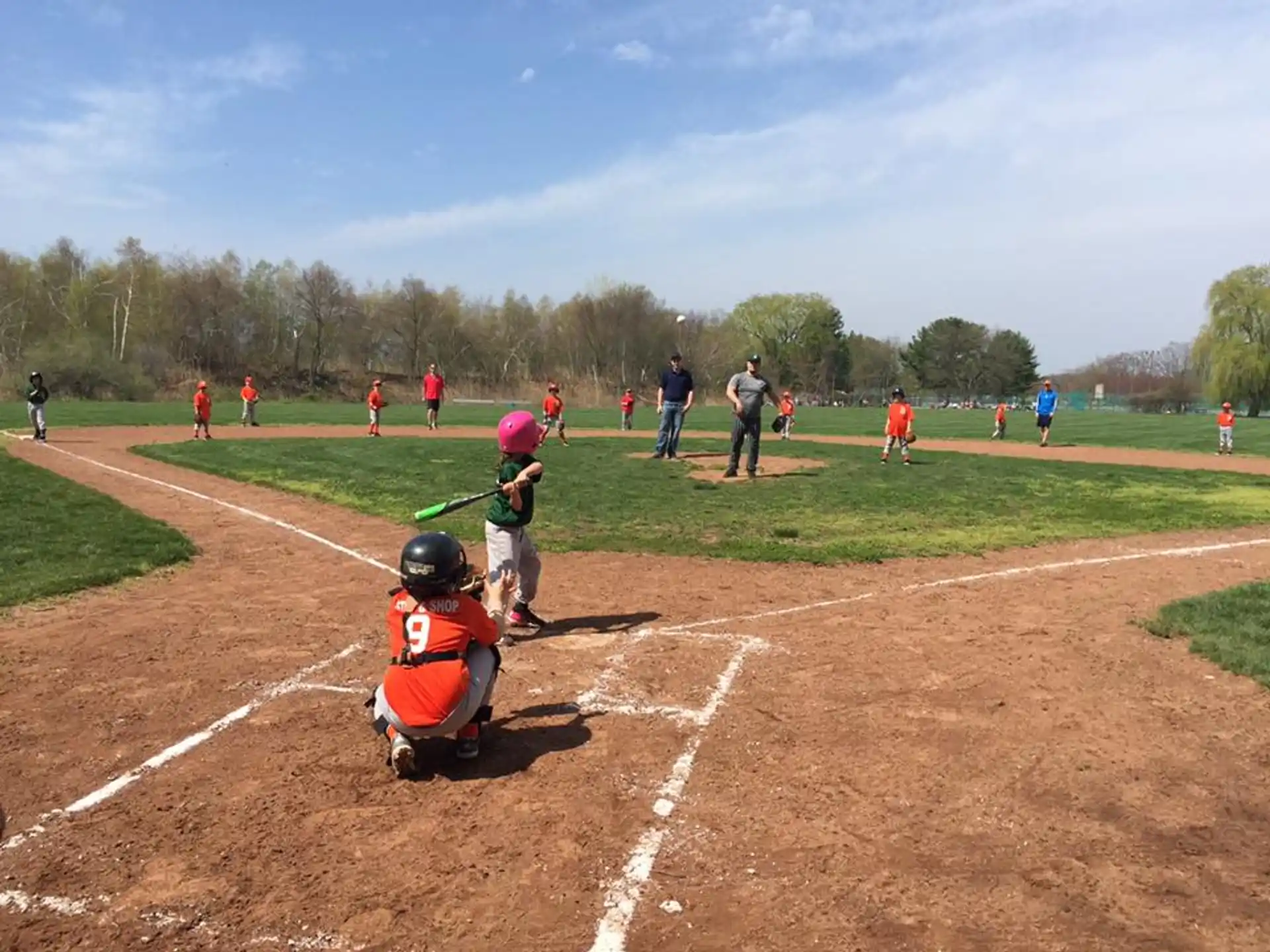 a kid swinging a baseball bat