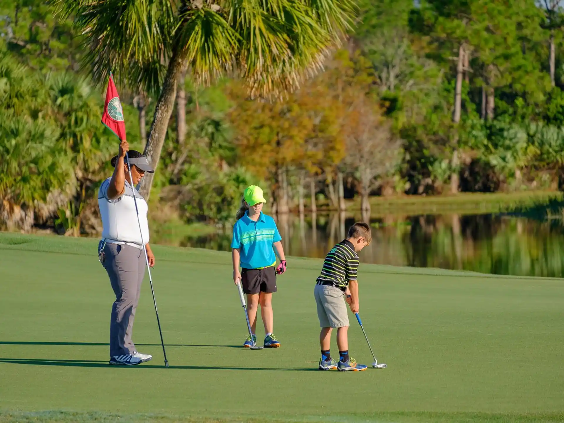 a group of people playing golf