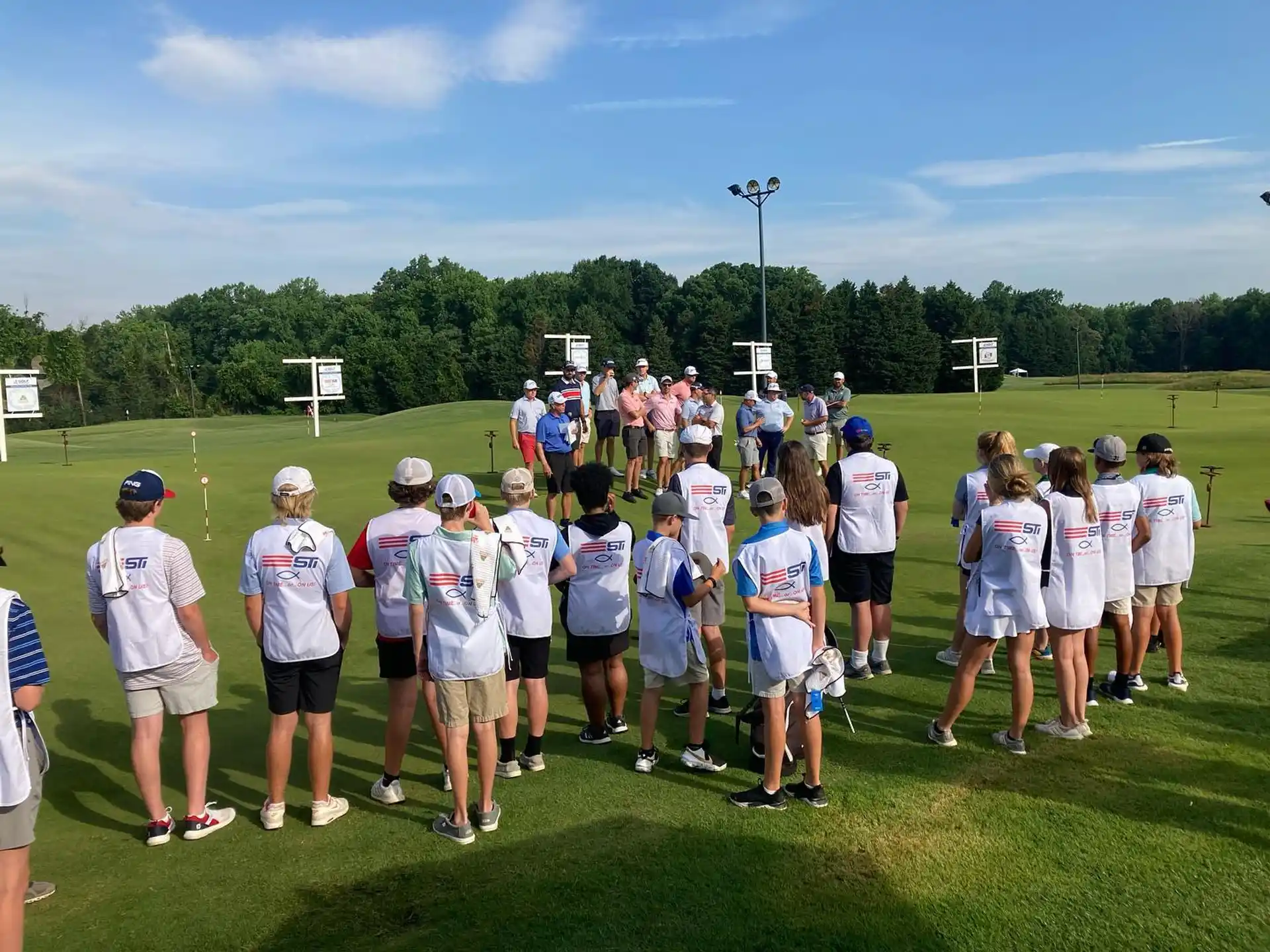 a group of people standing on a field