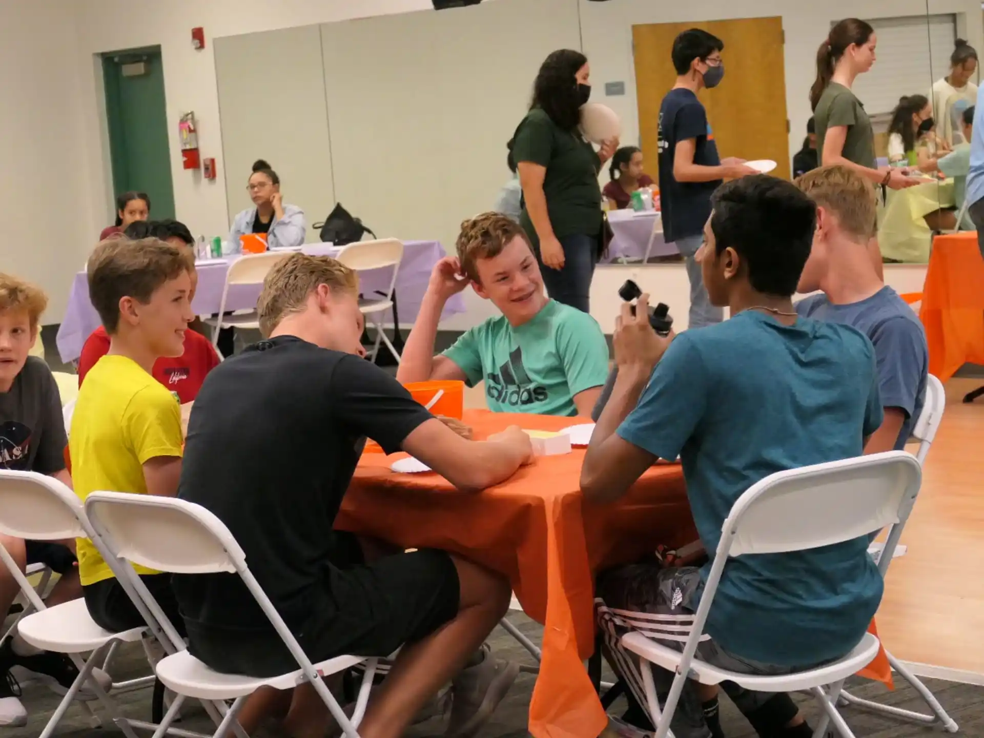 a group of people sitting around a table