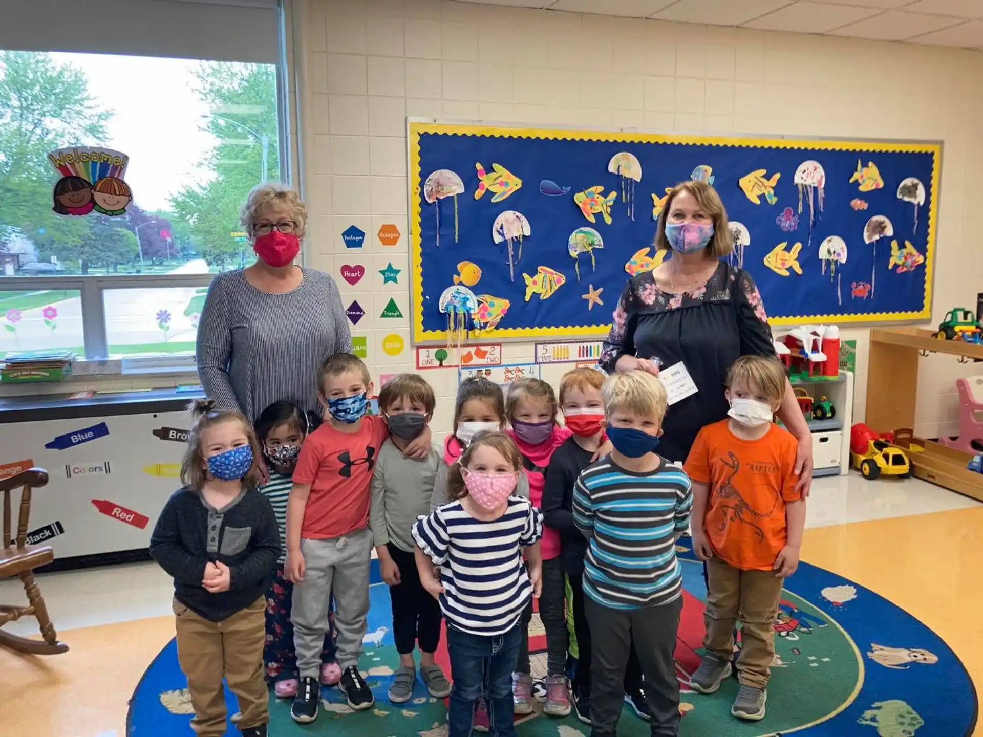 a group of children wearing masks