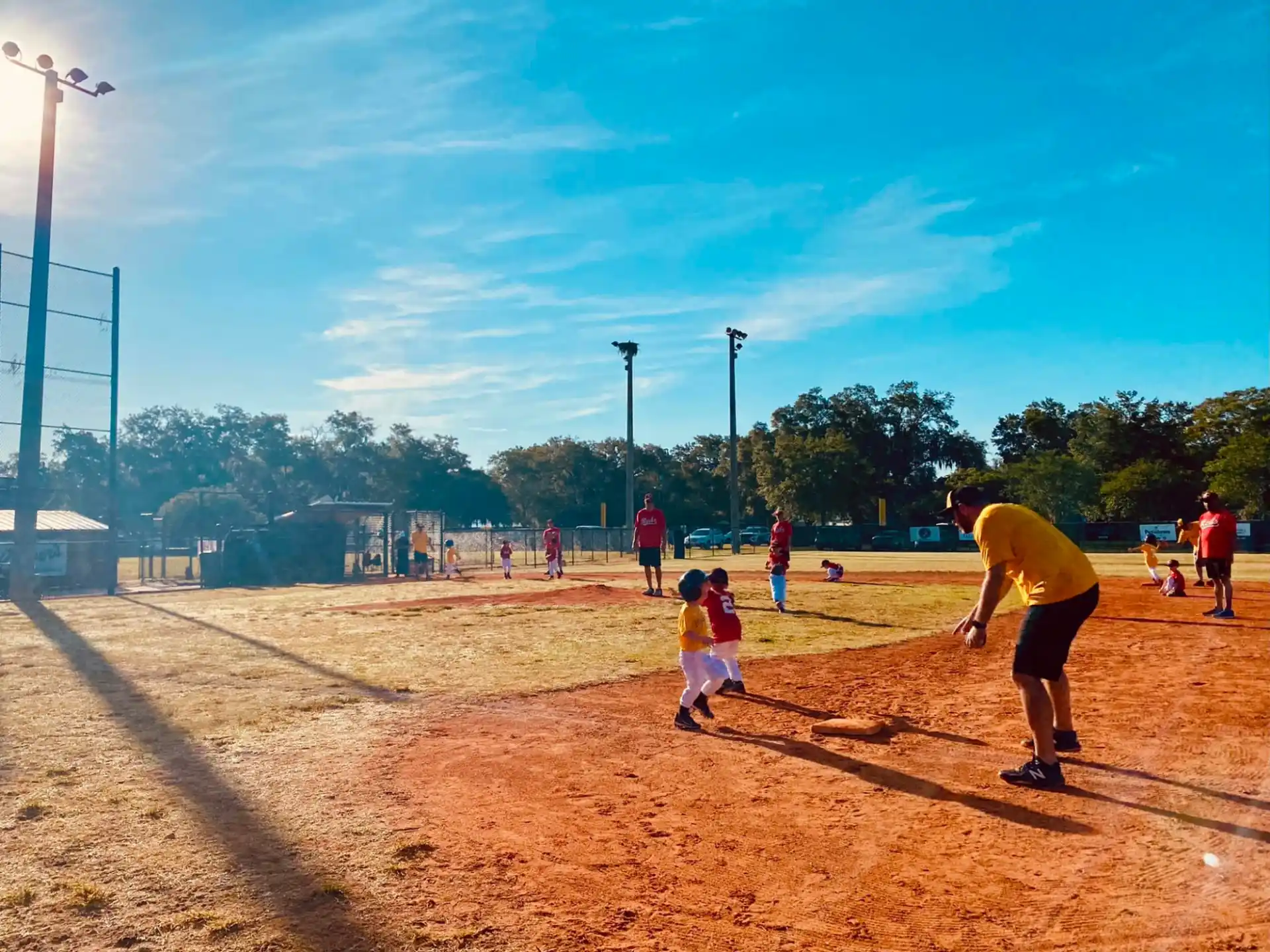 a group of people playing baseball
