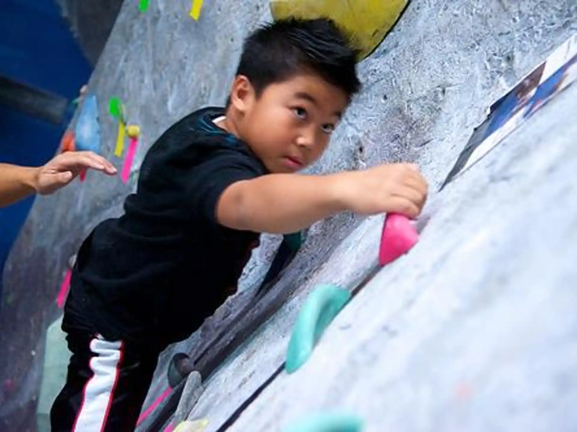 a boy climbing a slide