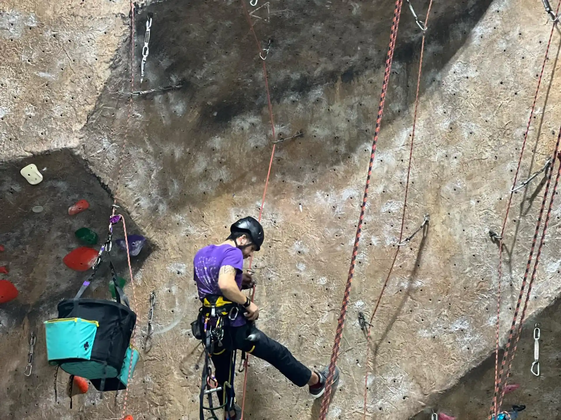 a person climbing a rock wall