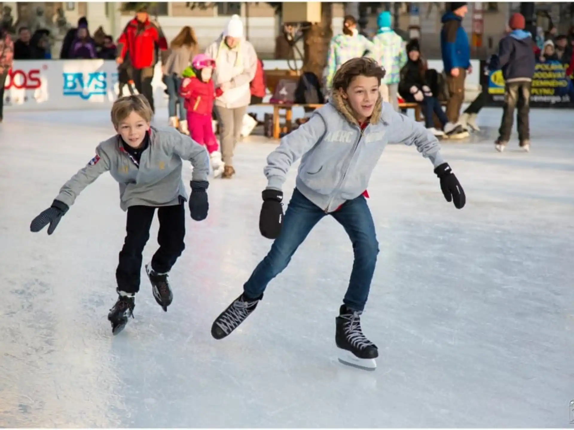 a couple of people ice skating