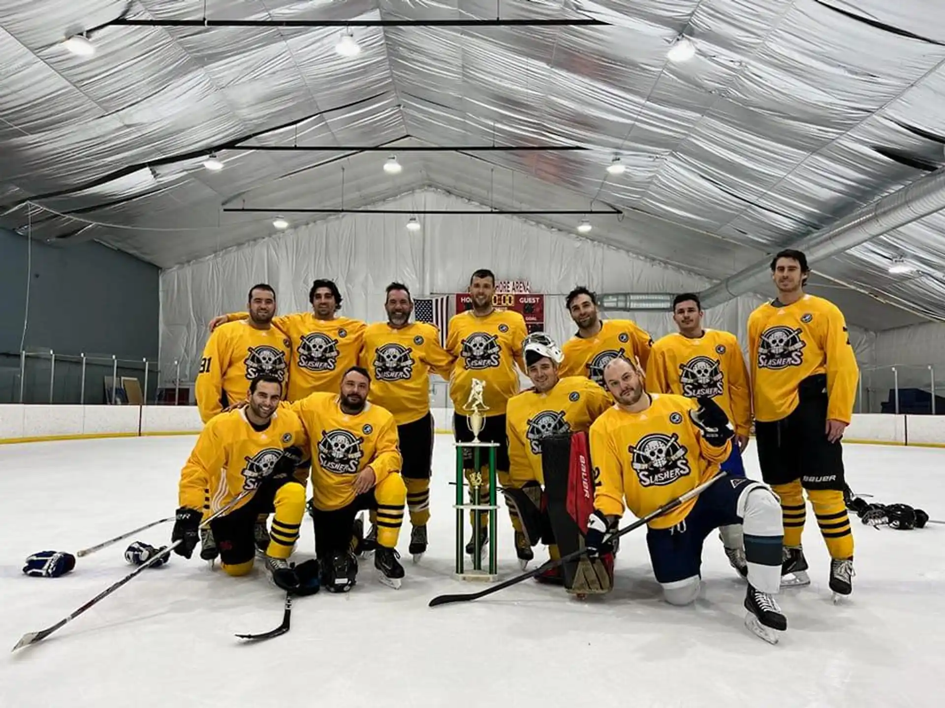 a group of hockey players posing for a photo