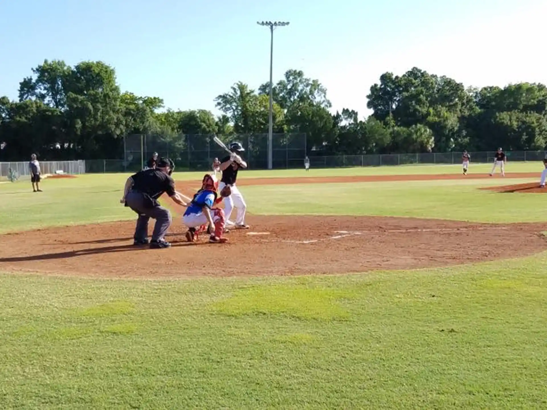 a baseball player prepares to swing a bat