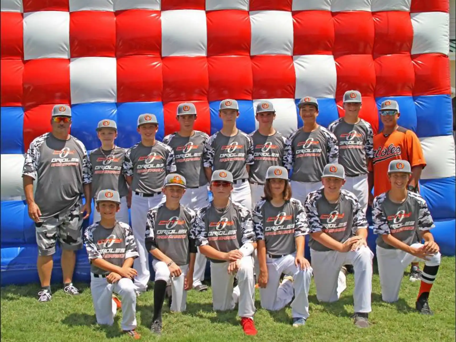 a group of baseball players posing for a photo