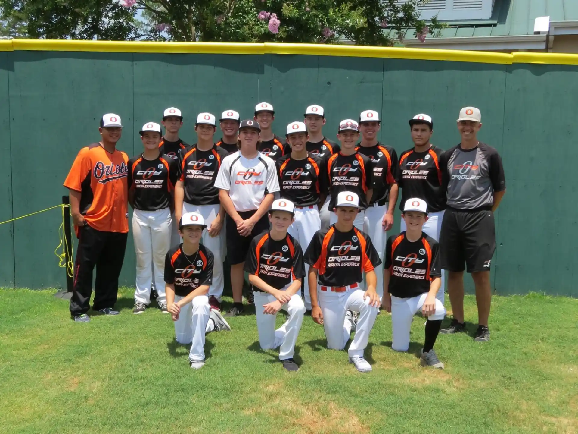 a group of baseball players posing for a photo