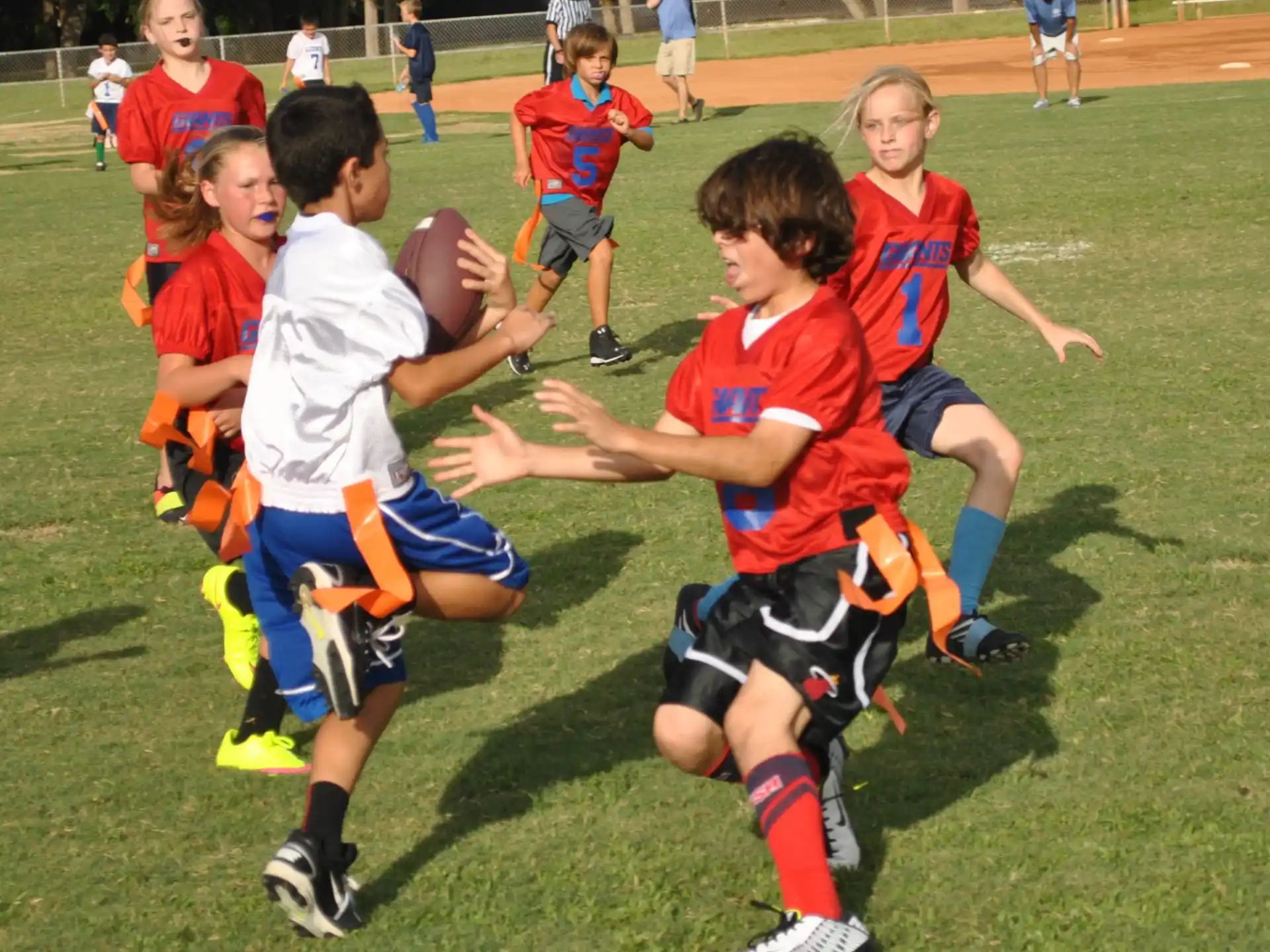 a group of kids playing football