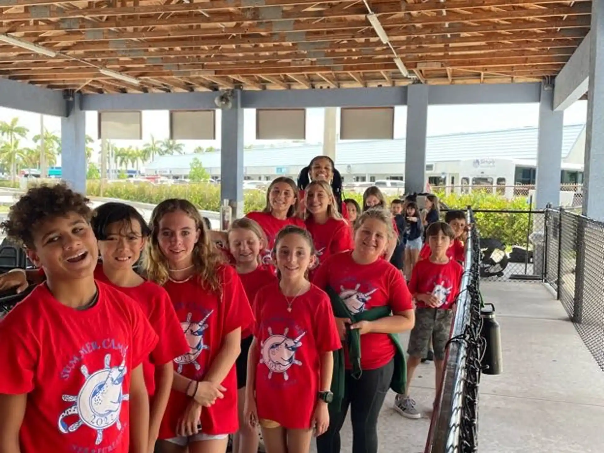 a group of people in red shirts
