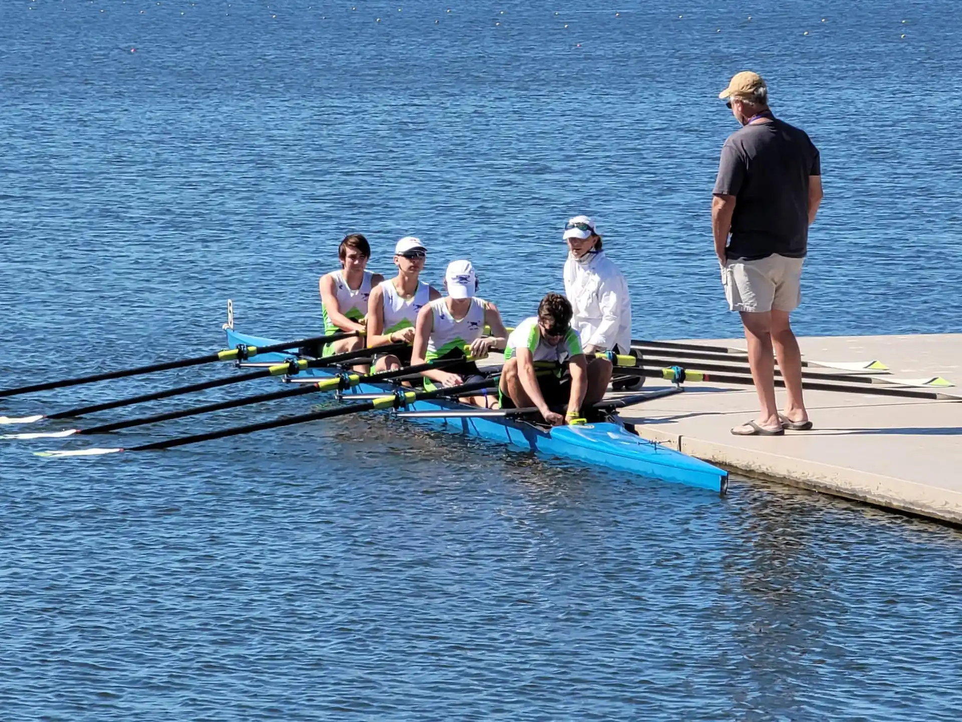 a group of people rowing a boat