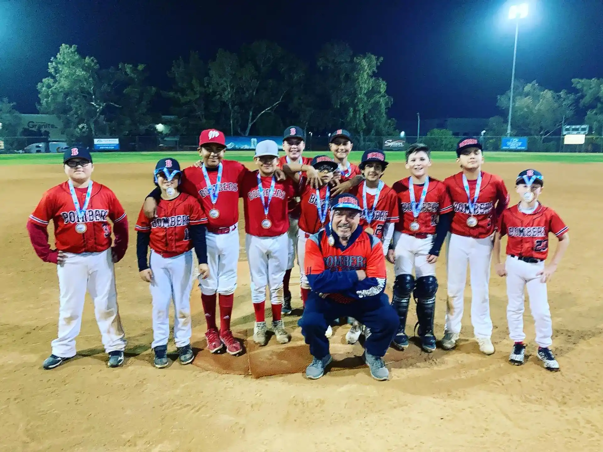 a group of baseball players posing for a photo