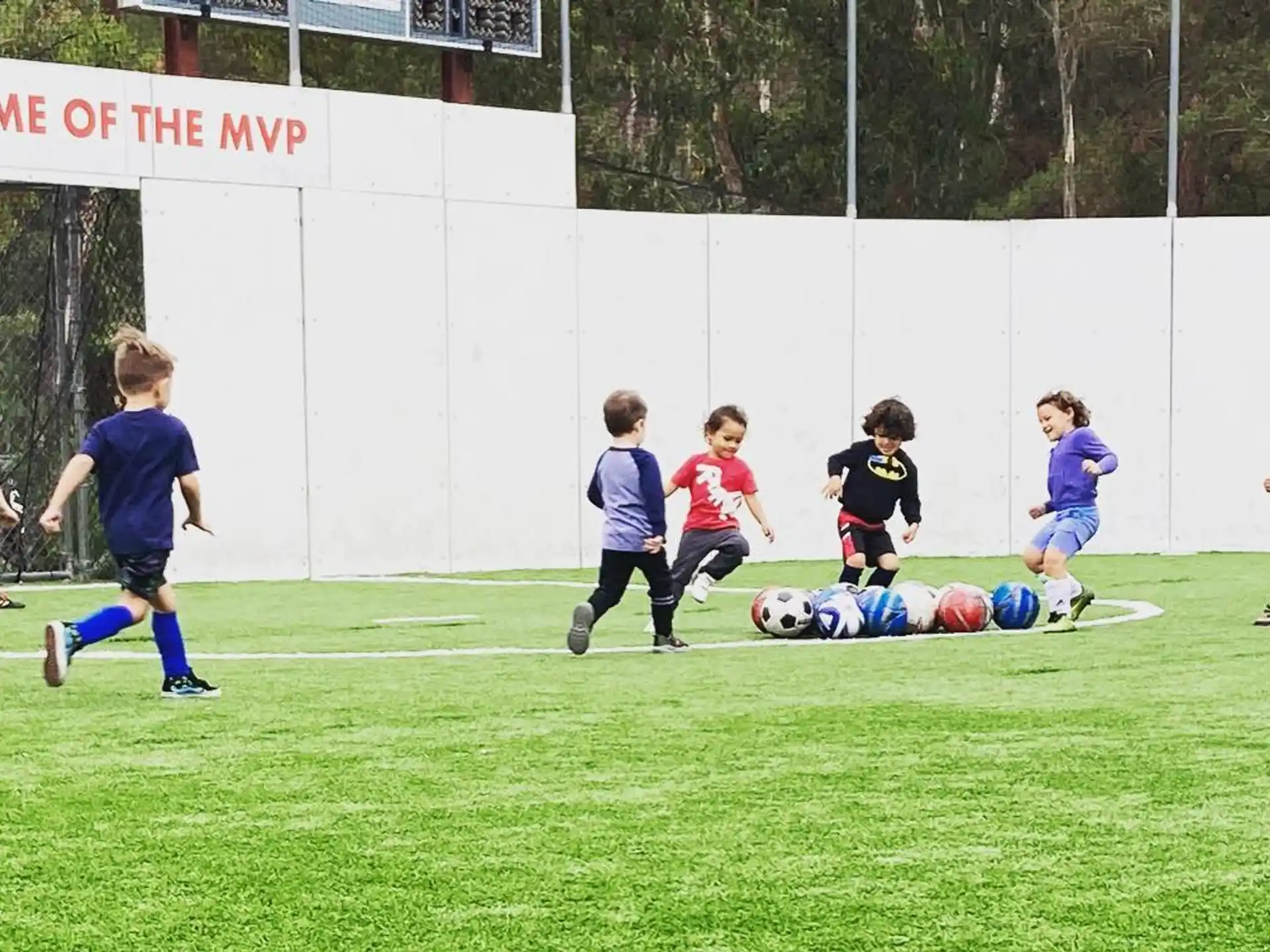 kids playing football on a field