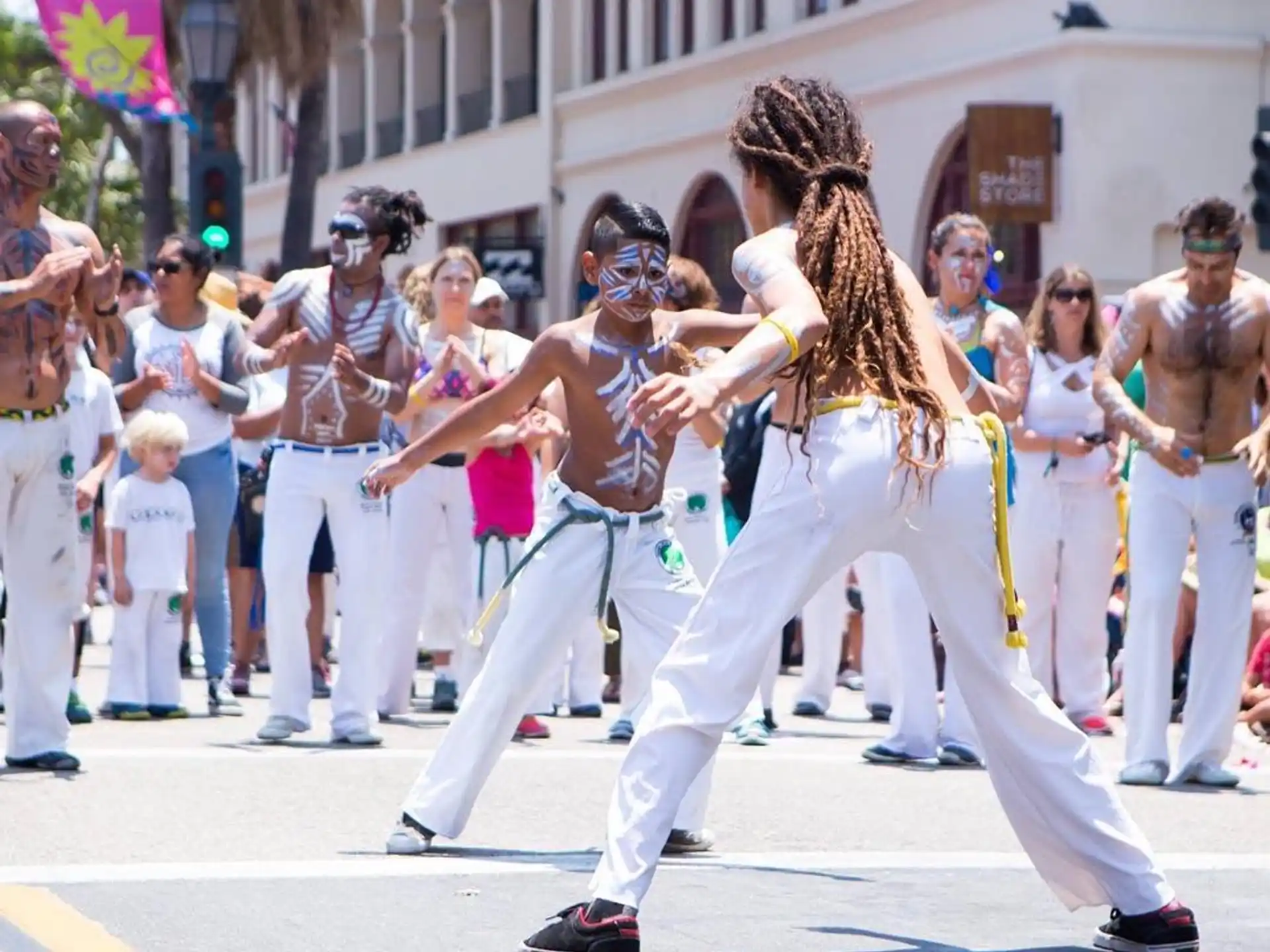 a man and woman dancing in a parade