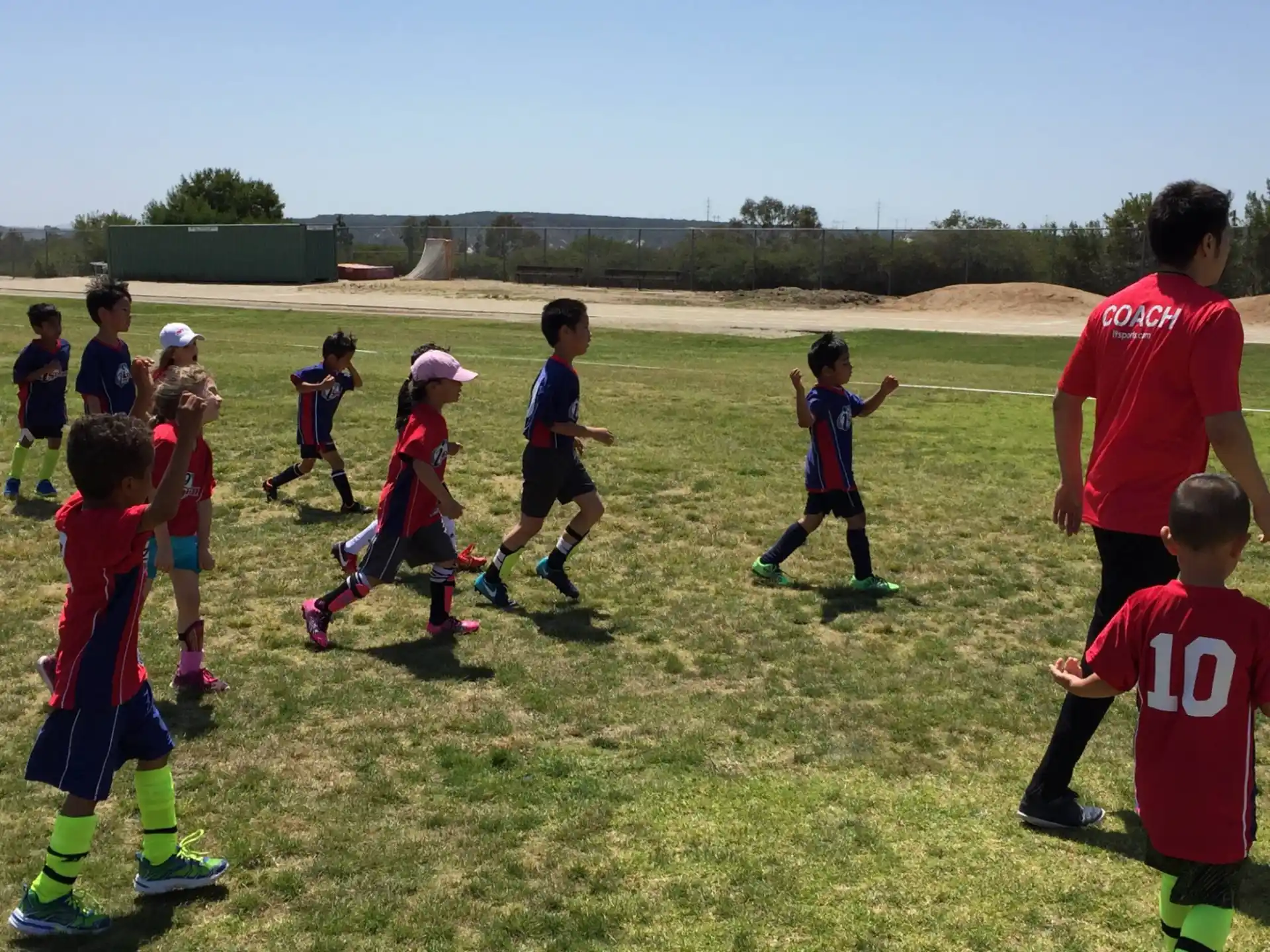 a group of kids playing football