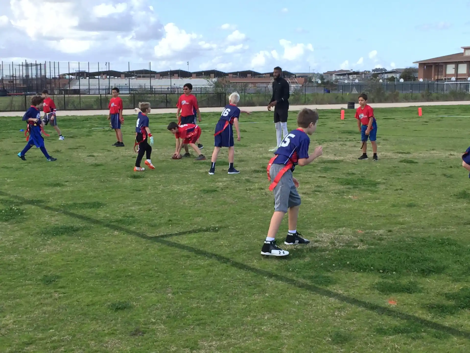 a group of kids playing football