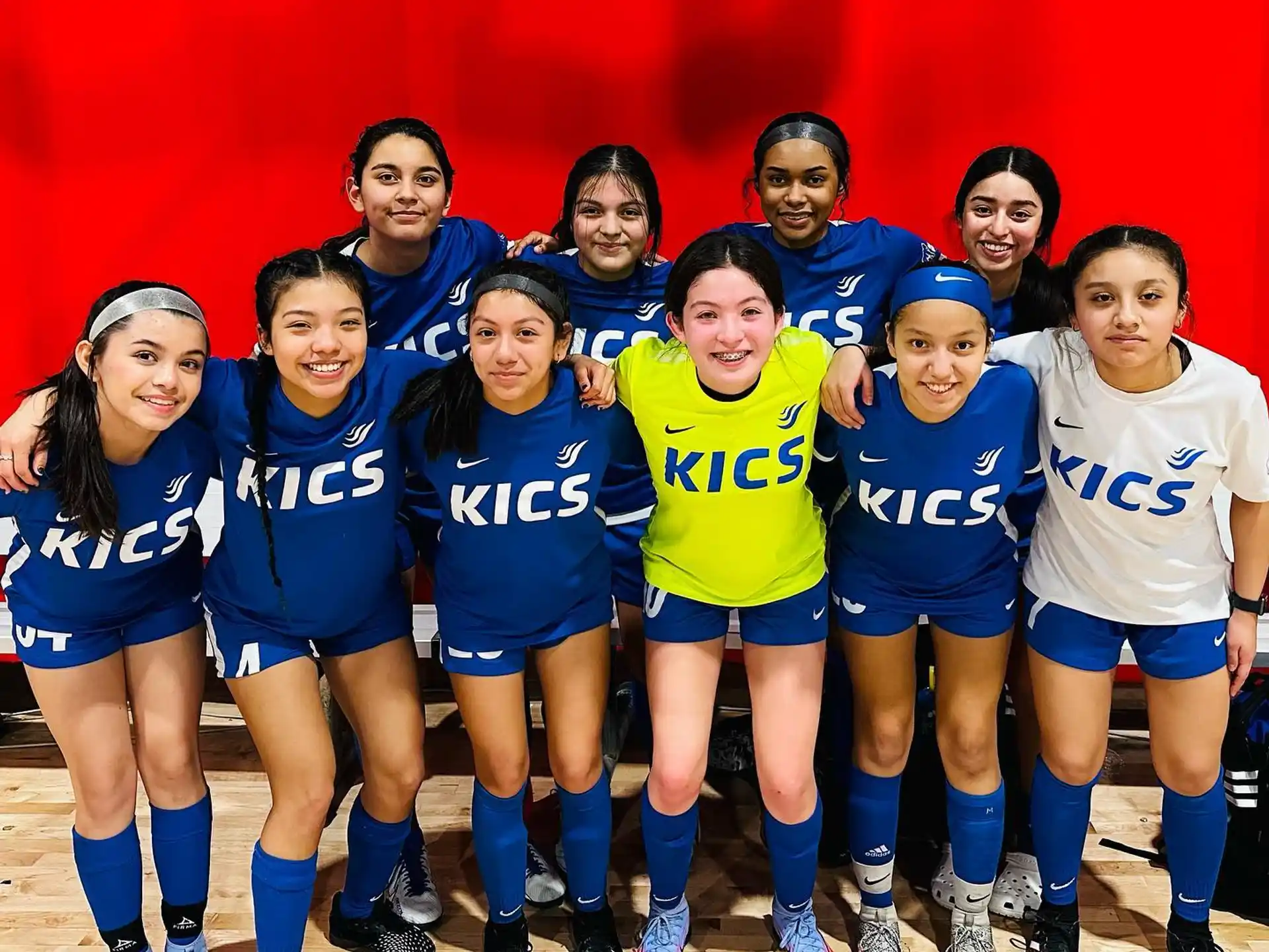 a group of girls in sports uniforms