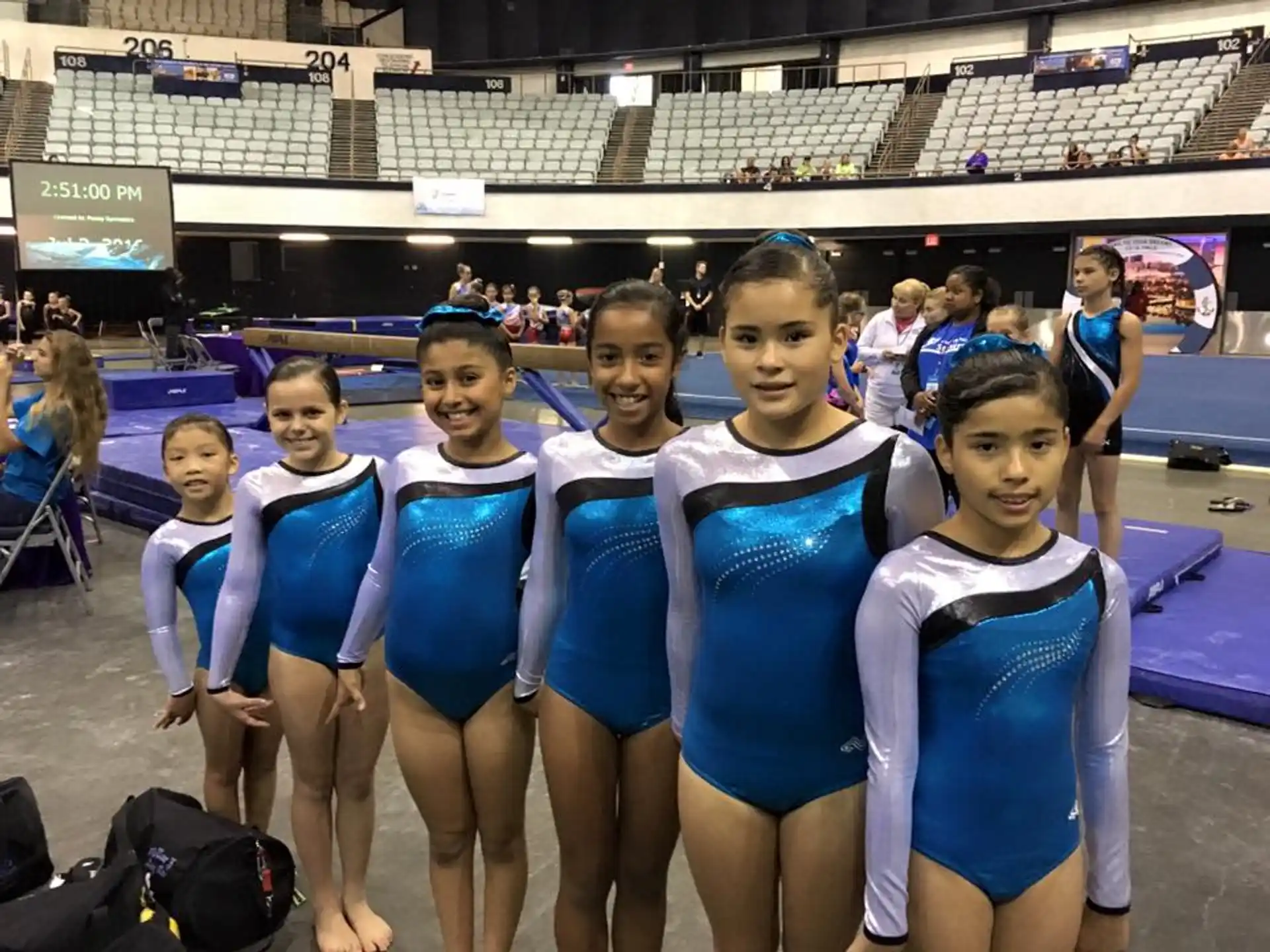 a group of girls in blue uniforms