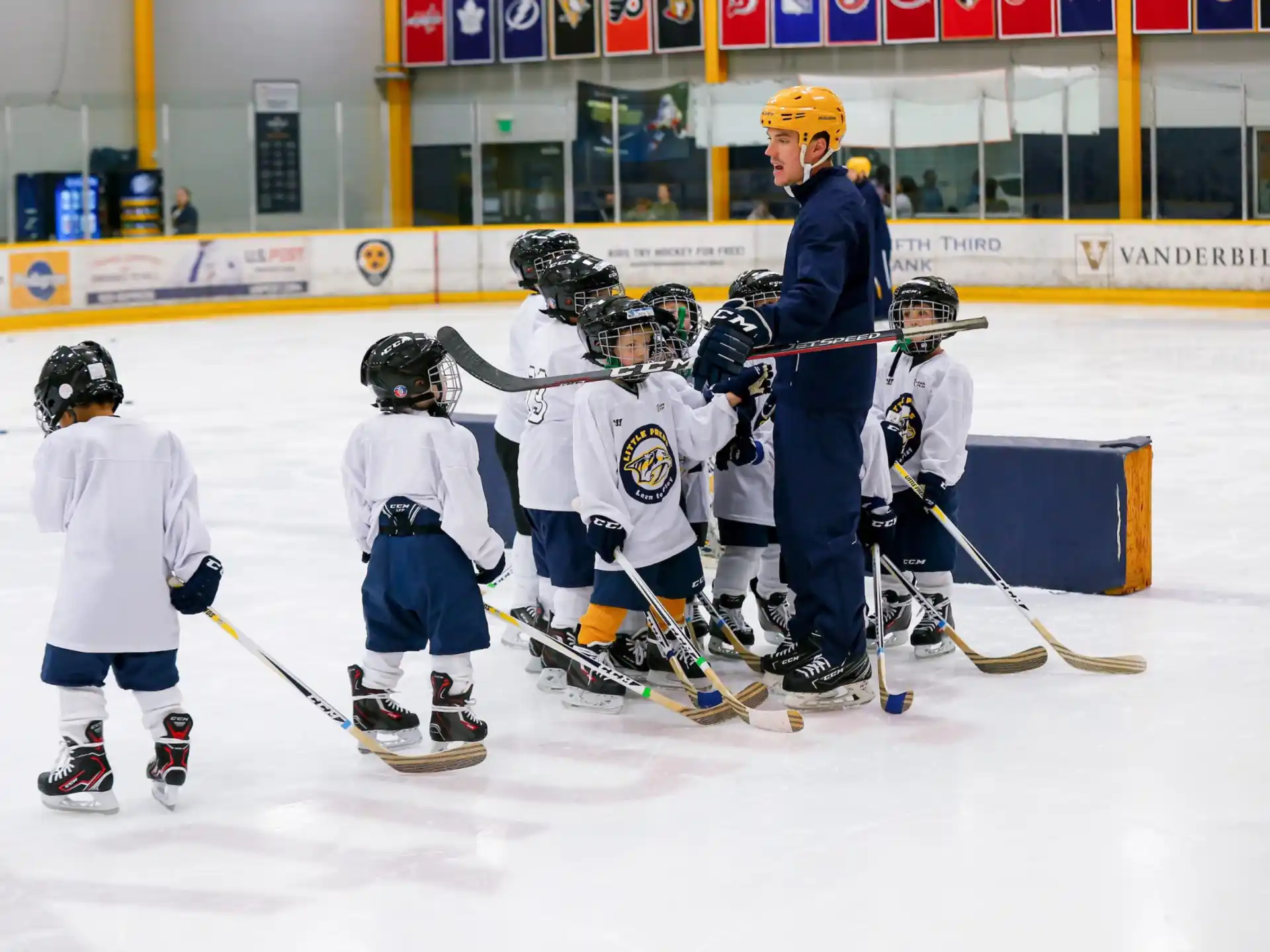 a group of people playing hockey
