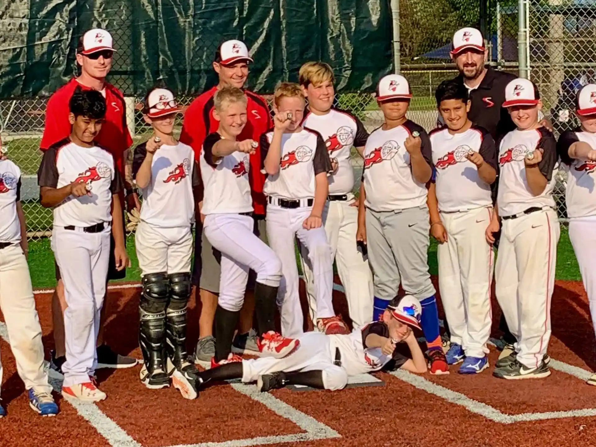 a group of baseball players posing for a photo