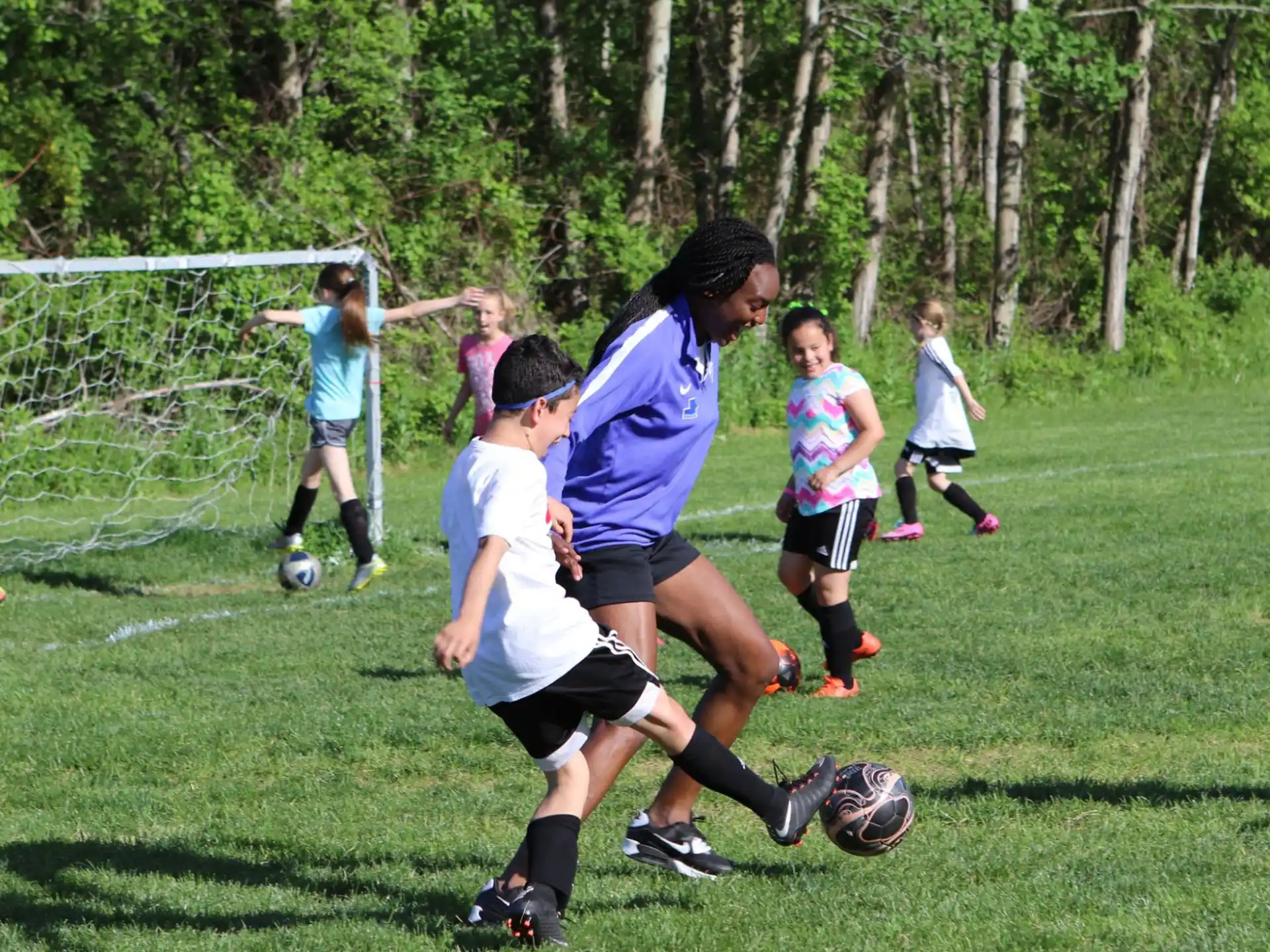 a group of kids playing football