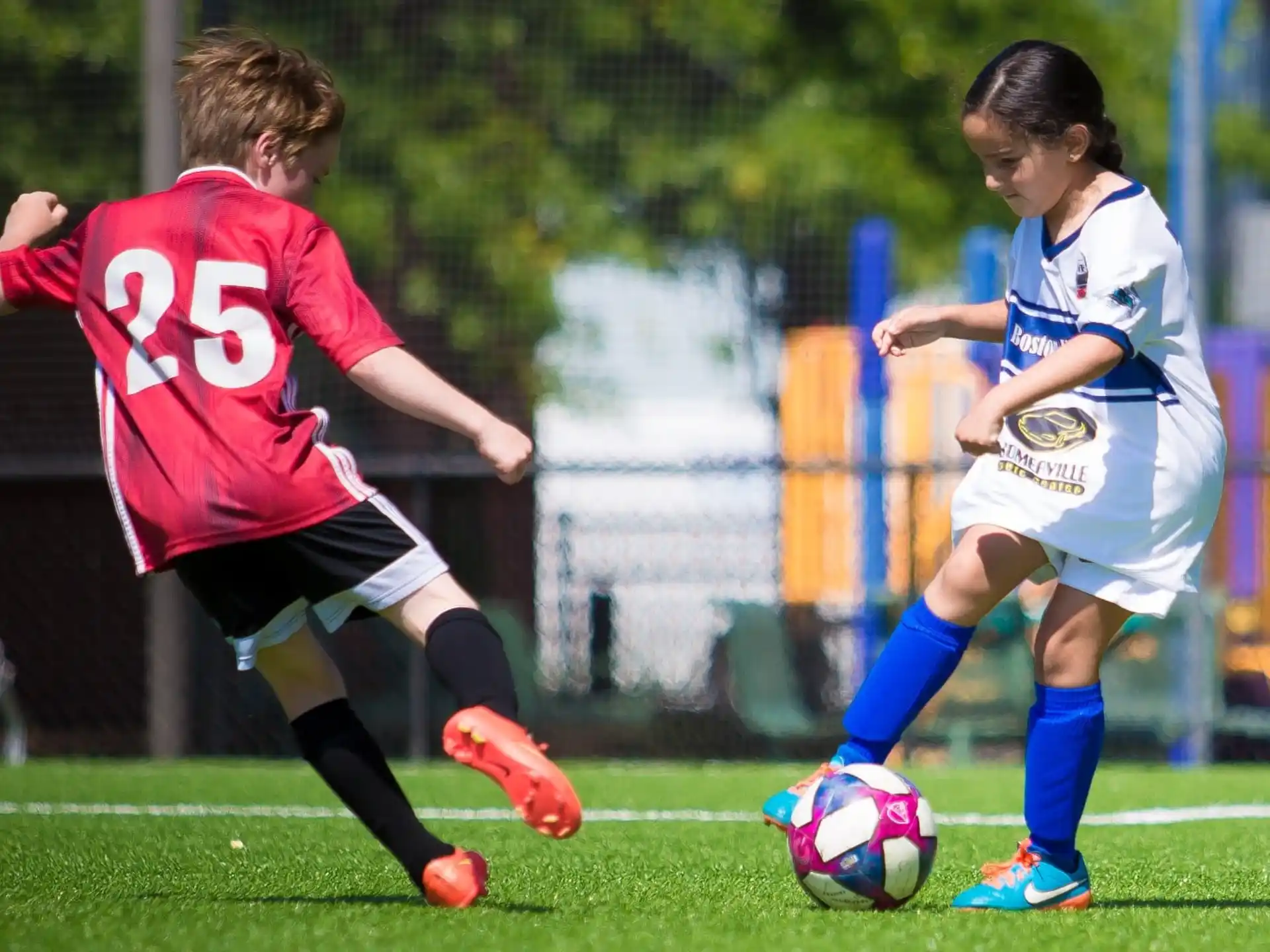 girls playing football on a field