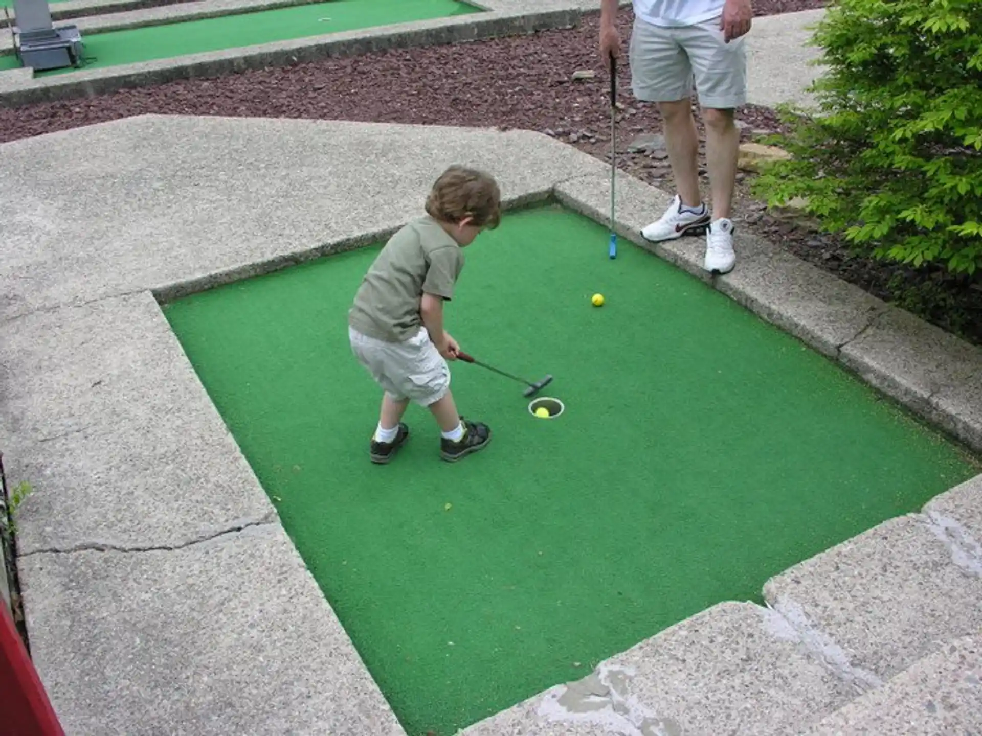 a boy playing golf