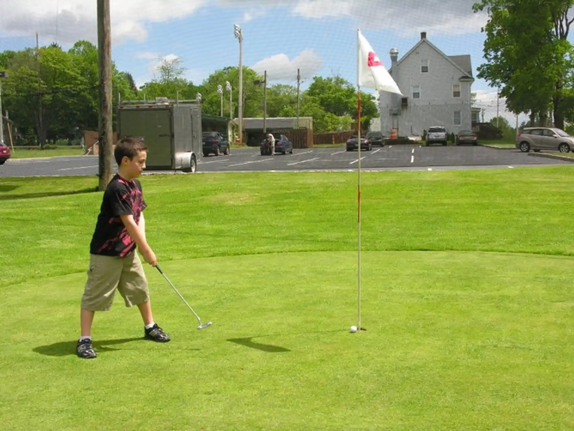 a boy playing golf