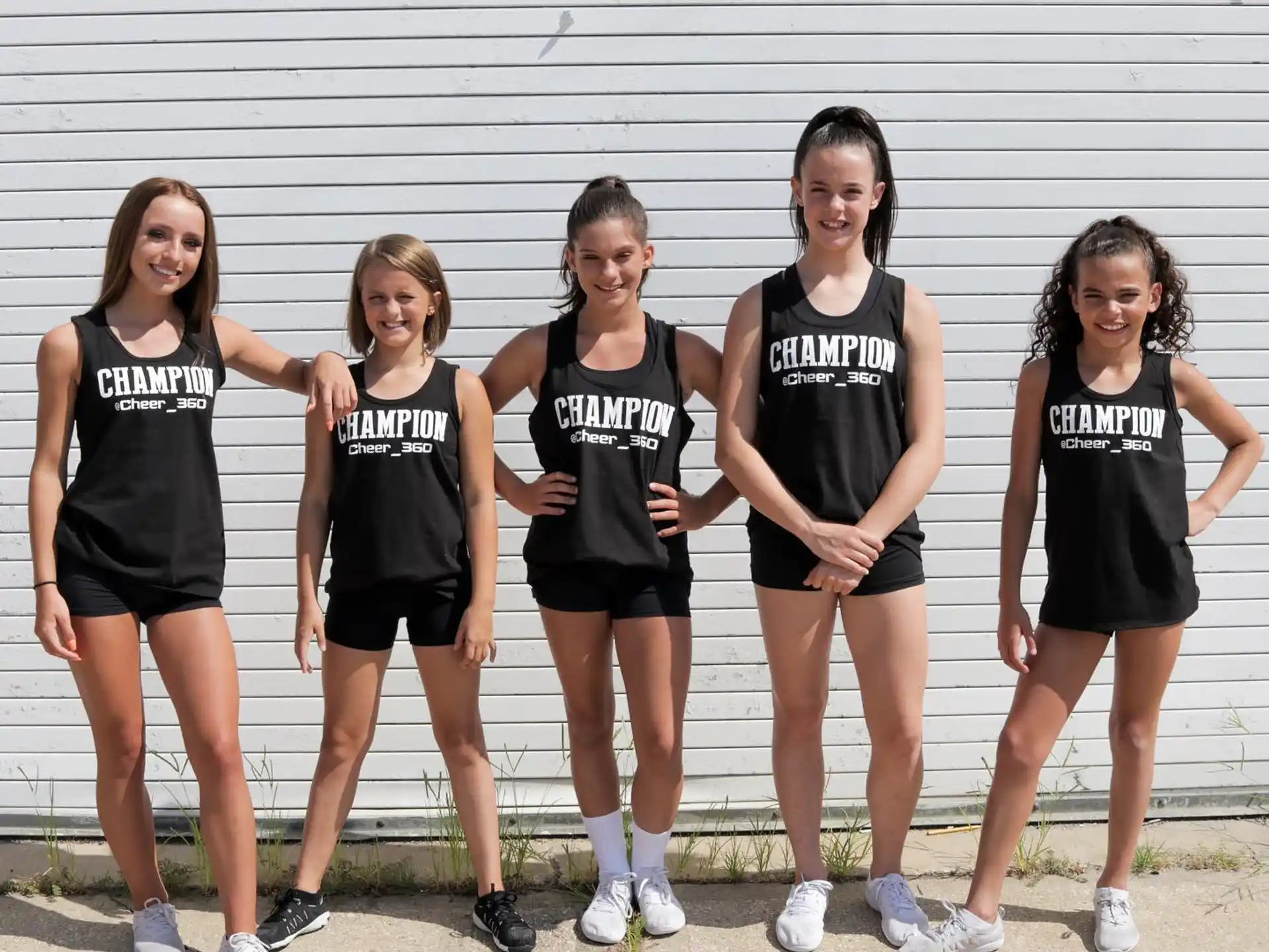 a group of girls in black shirts