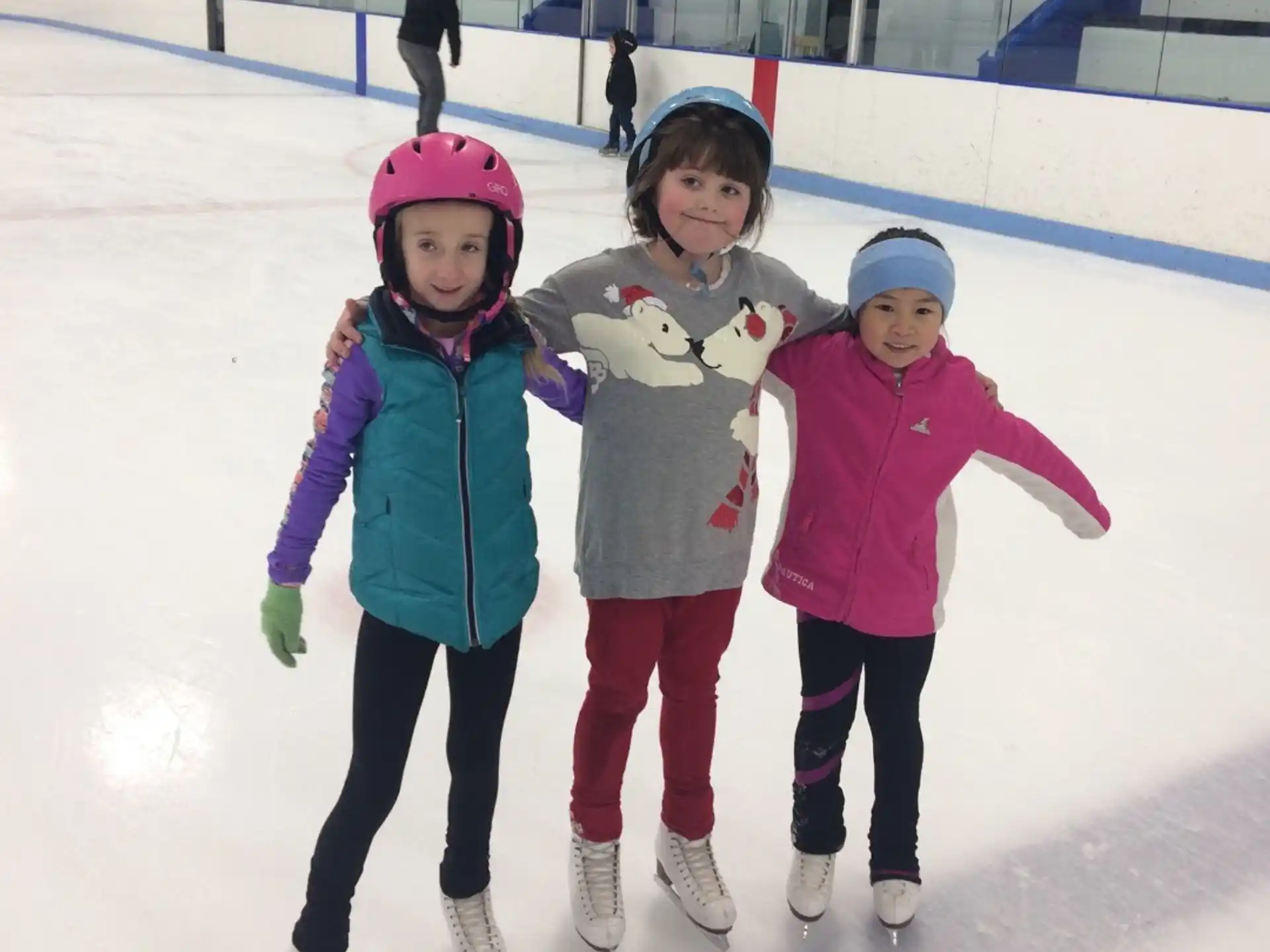 a group of girls on an ice rink