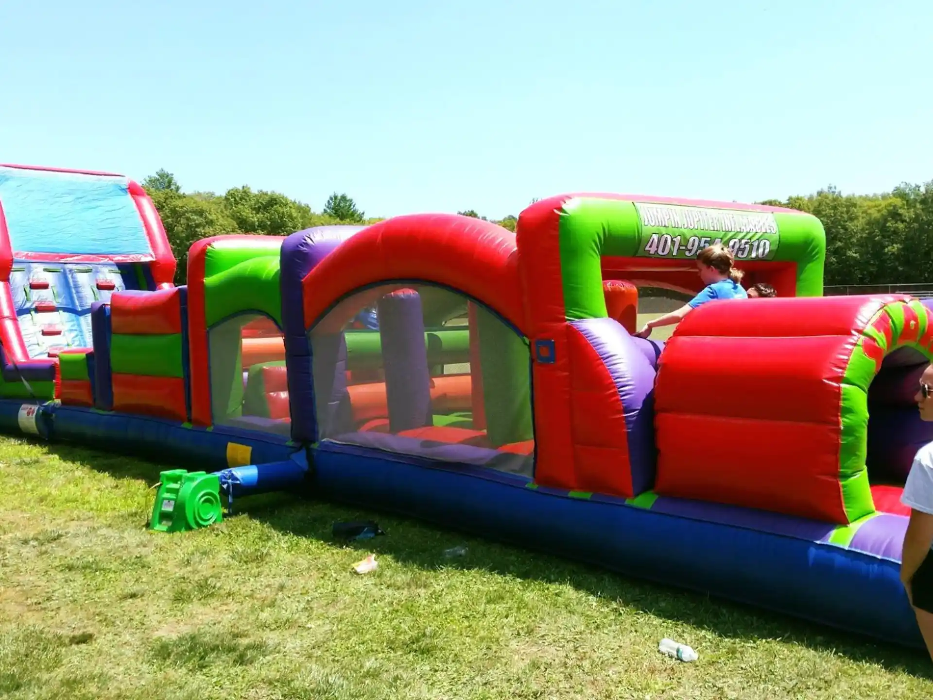 a group of people playing in a large colorful playground