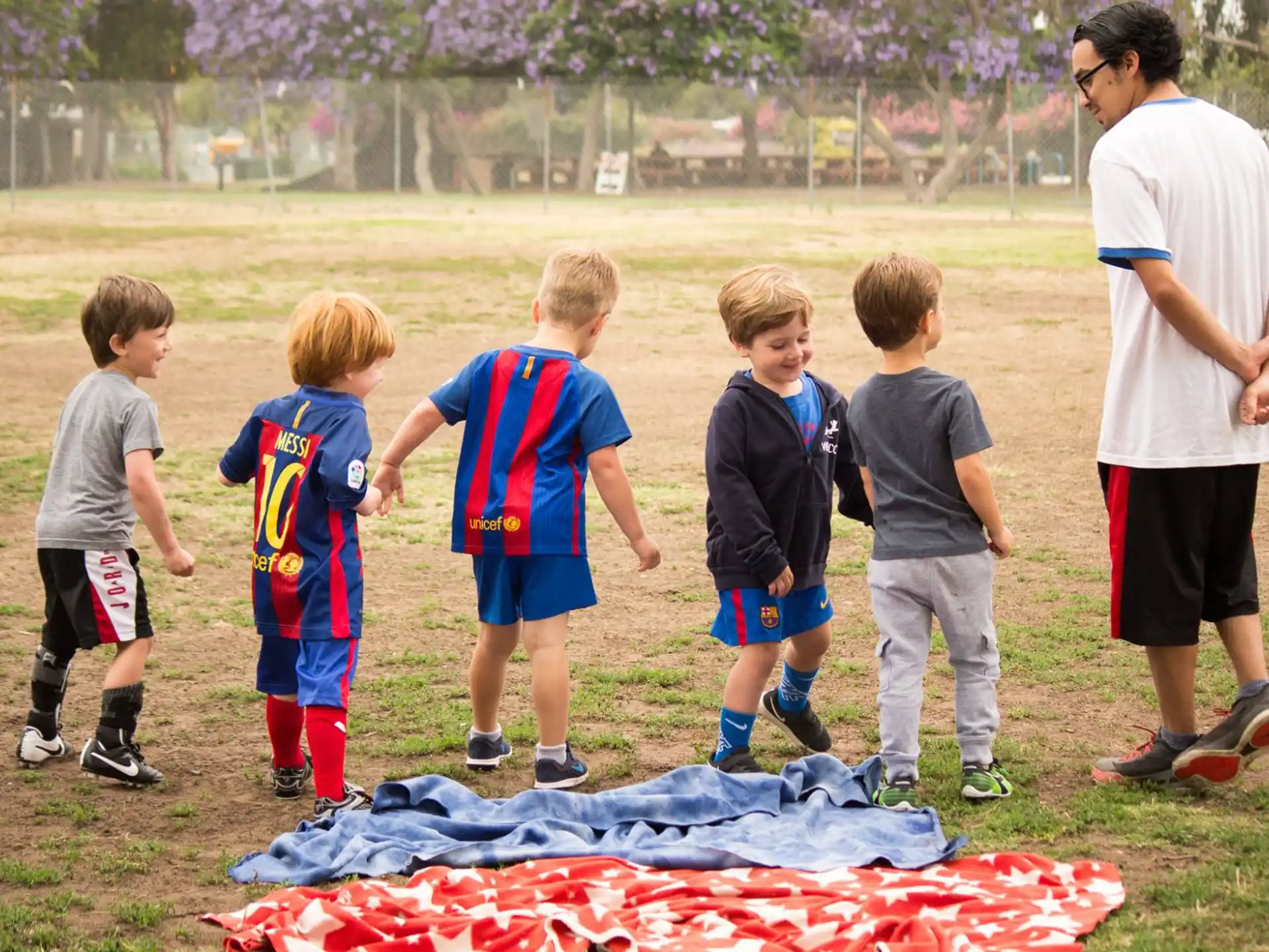 a group of kids playing football
