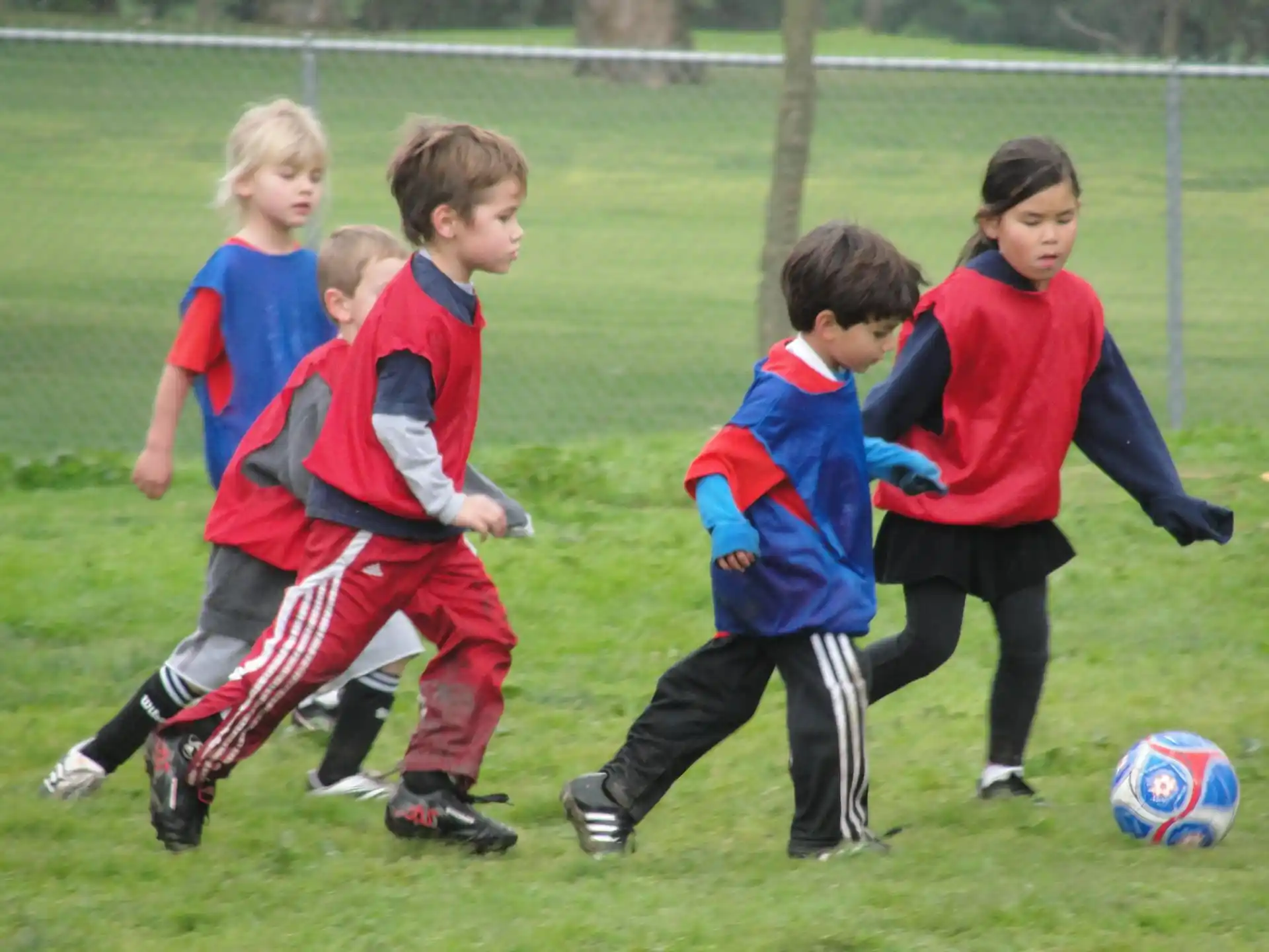 kids playing football on a field