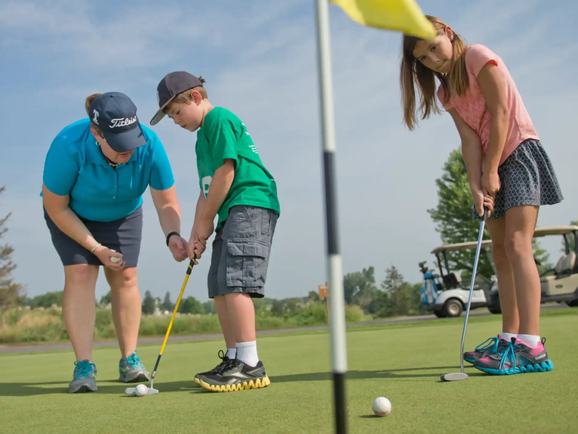 a group of people playing golf