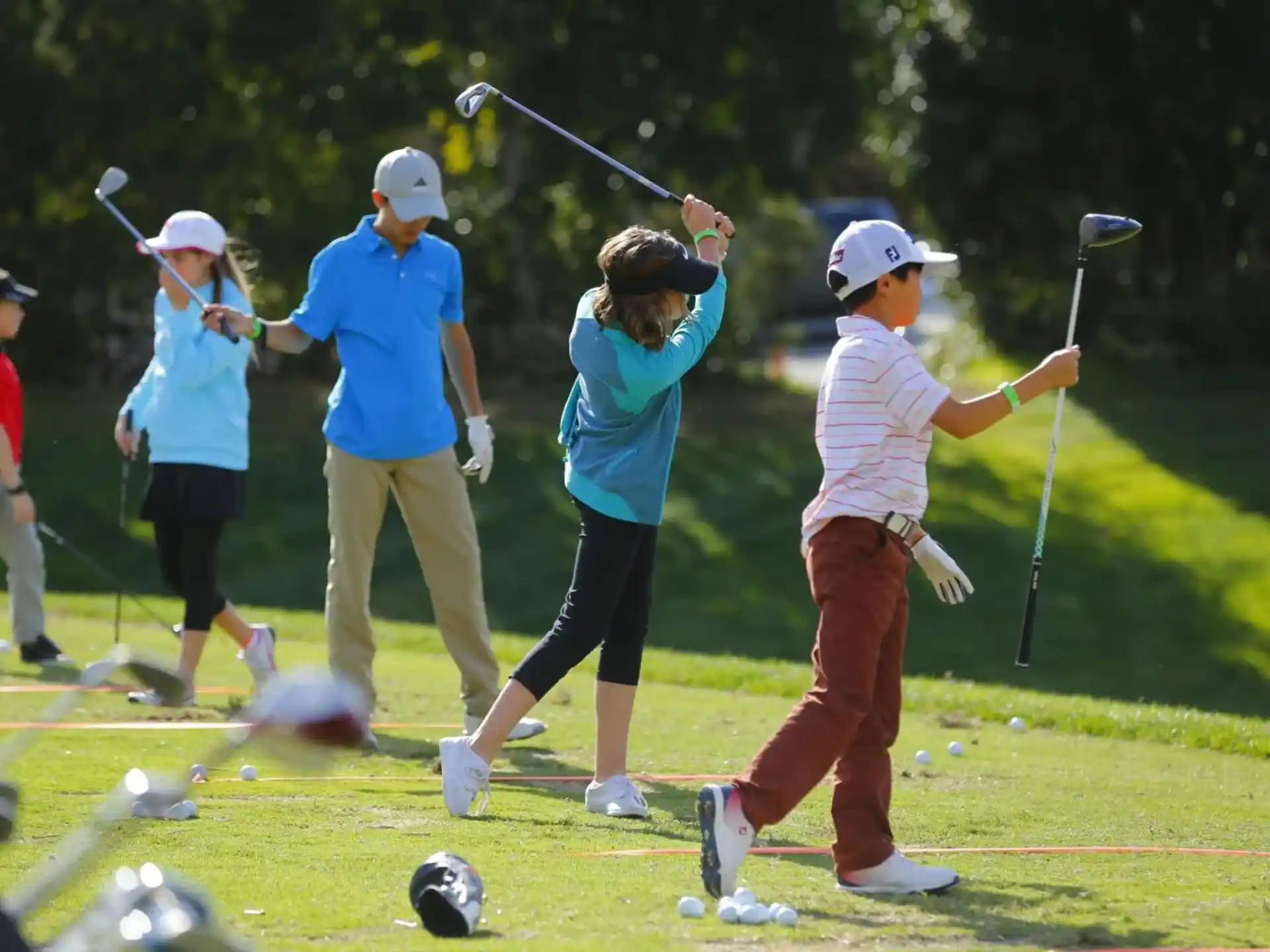 a group of people playing golf