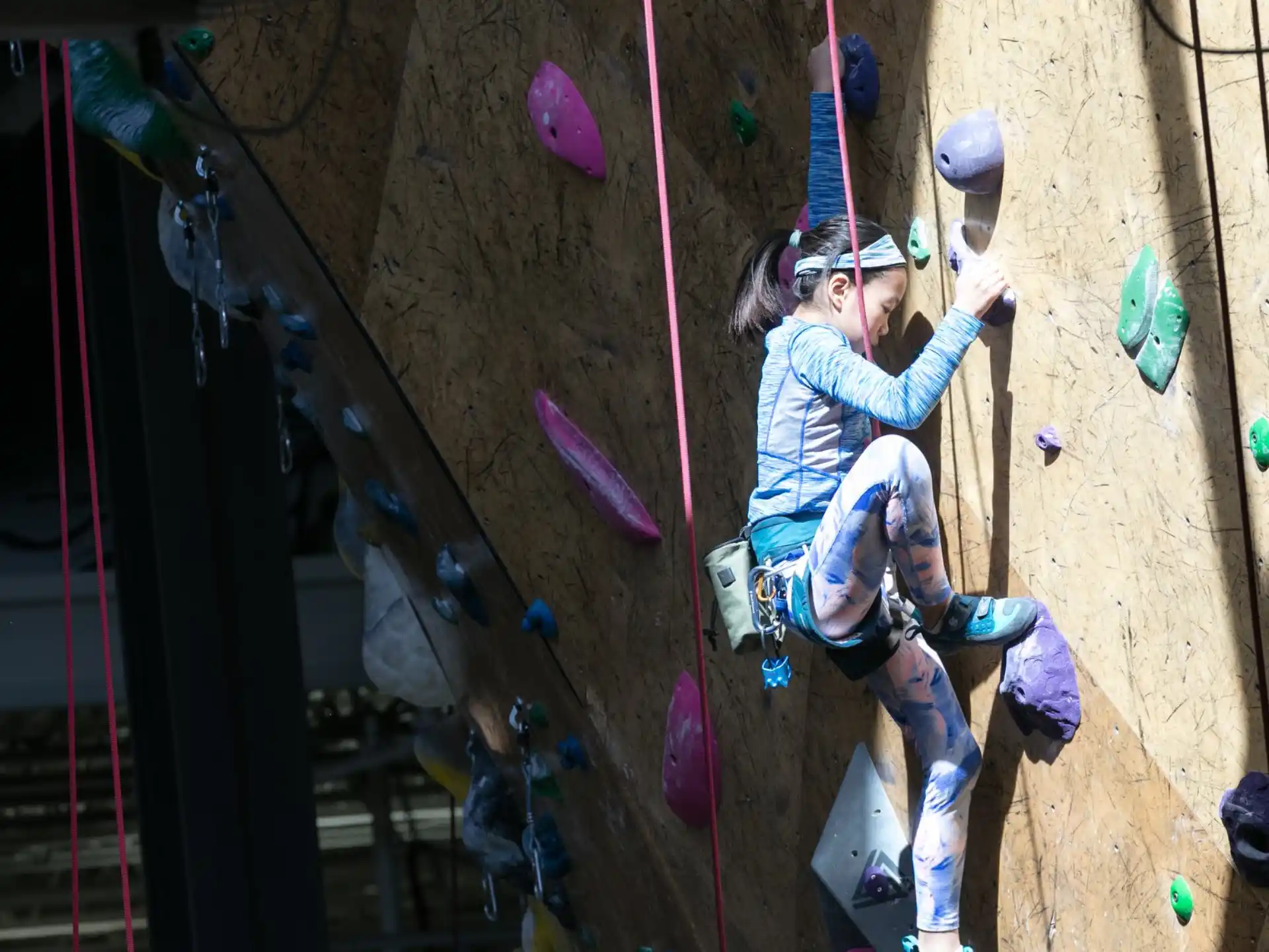 a person climbing a rock wall