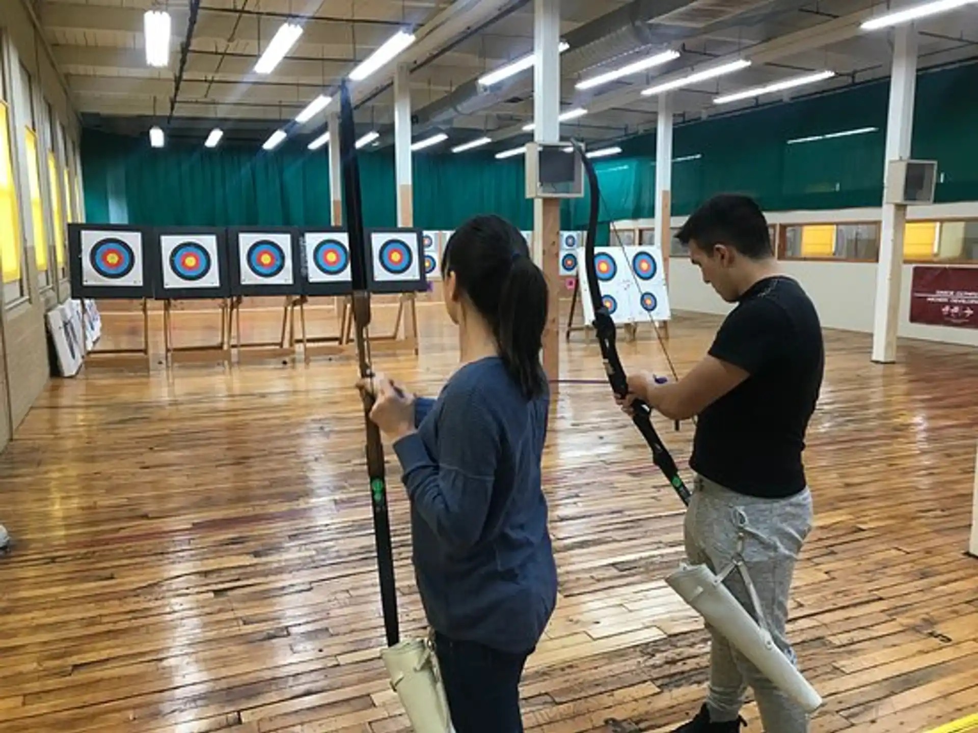 a man and a woman holding guns