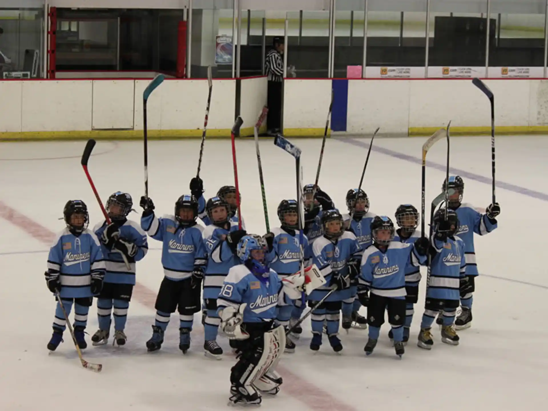 a group of hockey players posing for a photo
