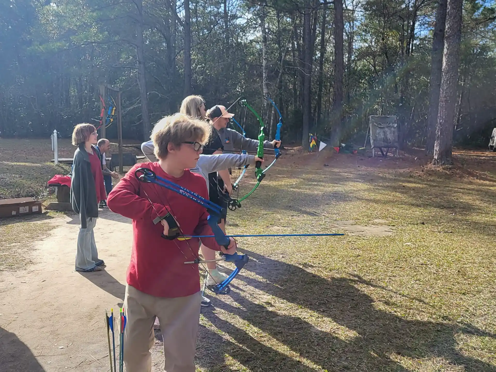 a group of people shooting bows