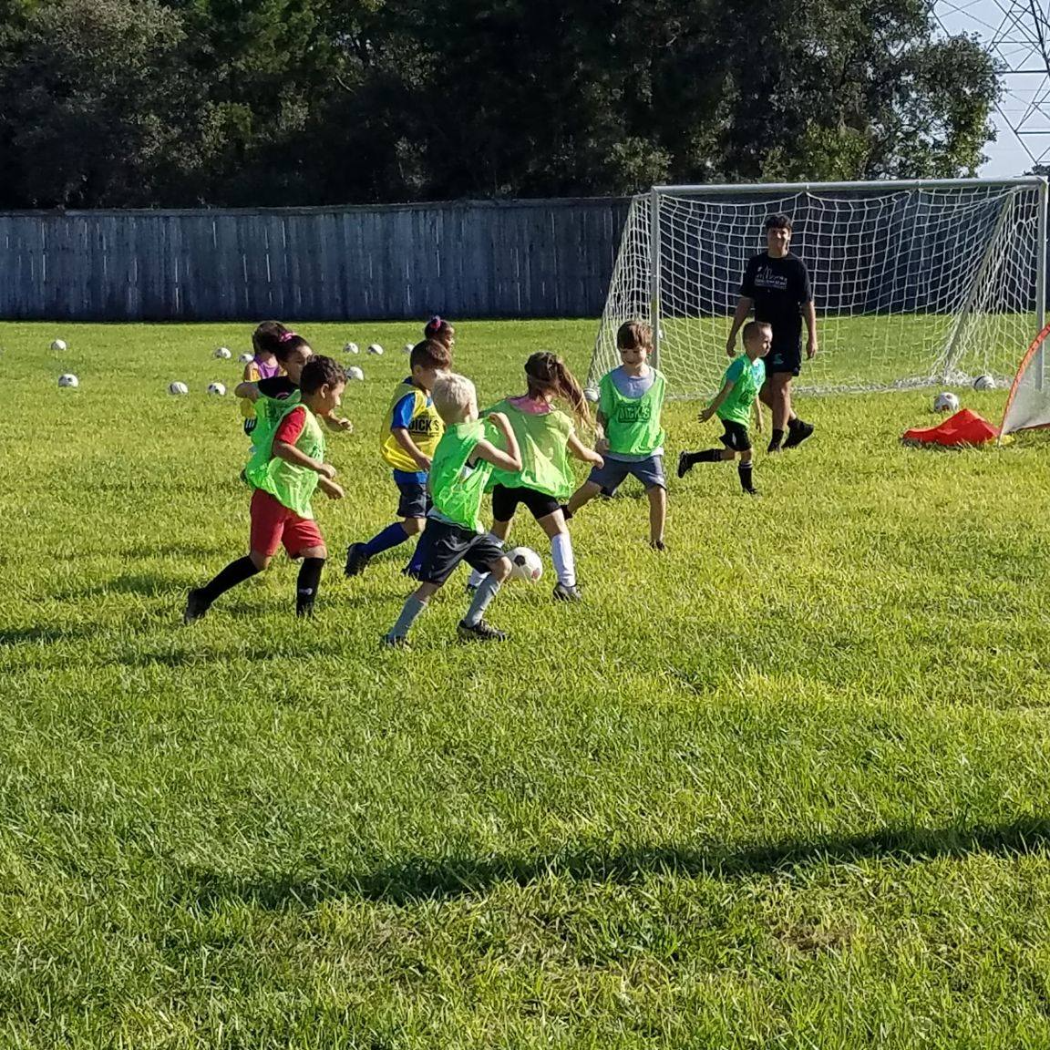 a group of kids playing football