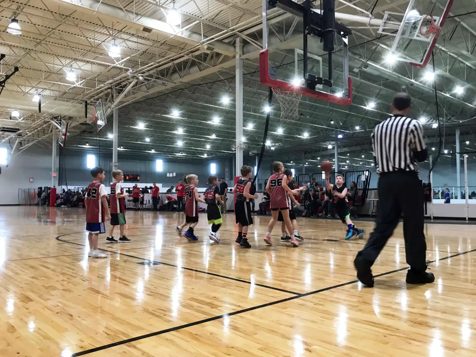 a group of people playing basketball