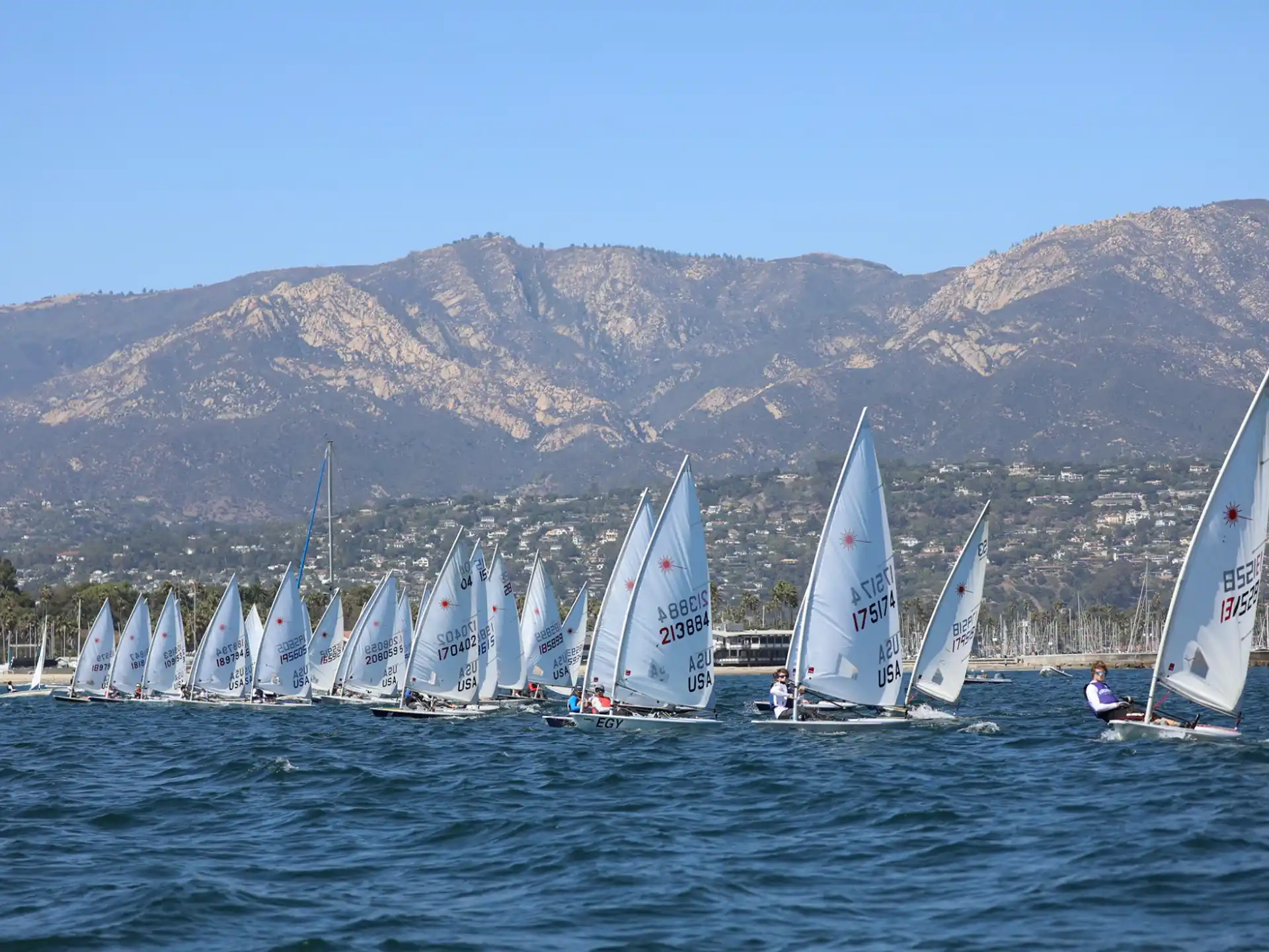 a group of sailboats on the water