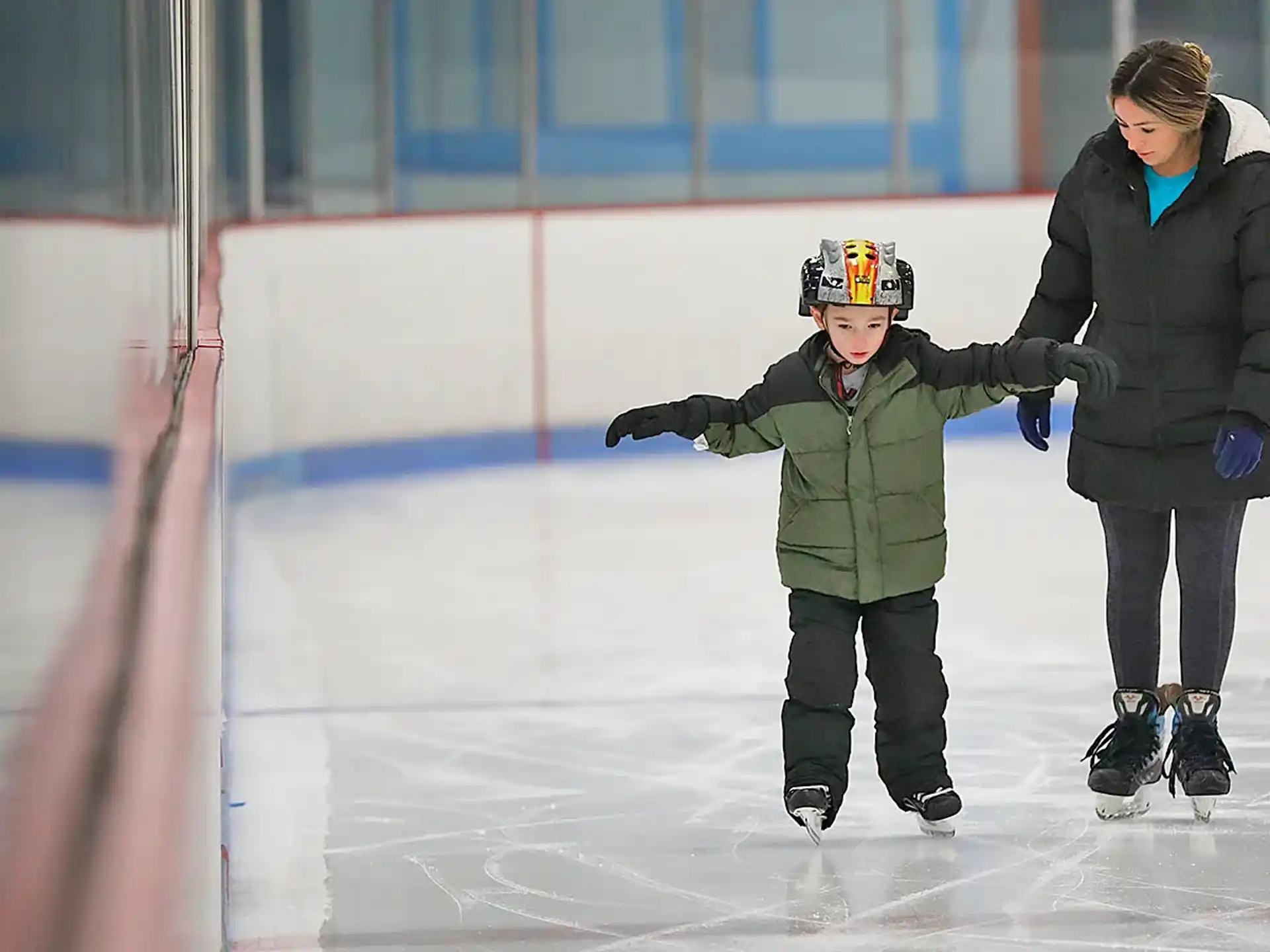 a person and a child ice skating