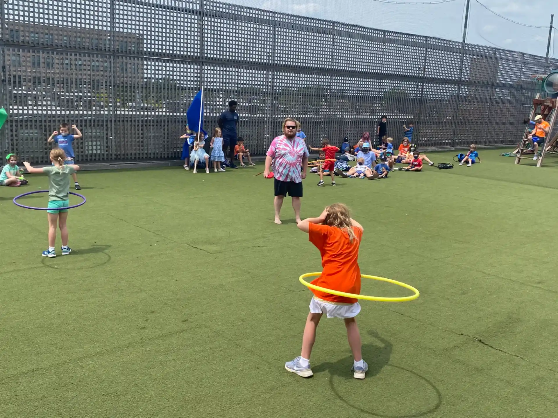 a group of people playing tennis