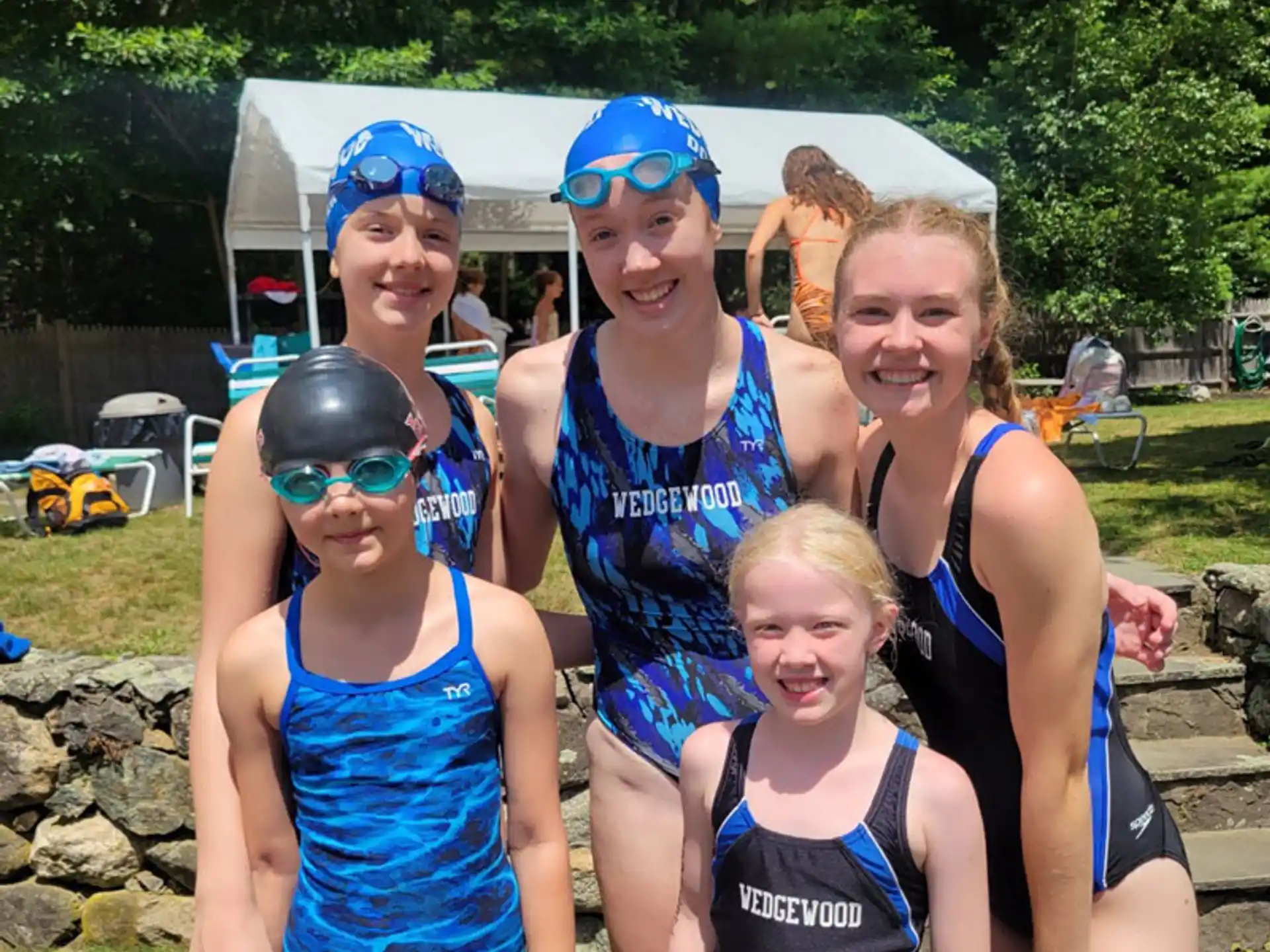 a group of people wearing swim suits