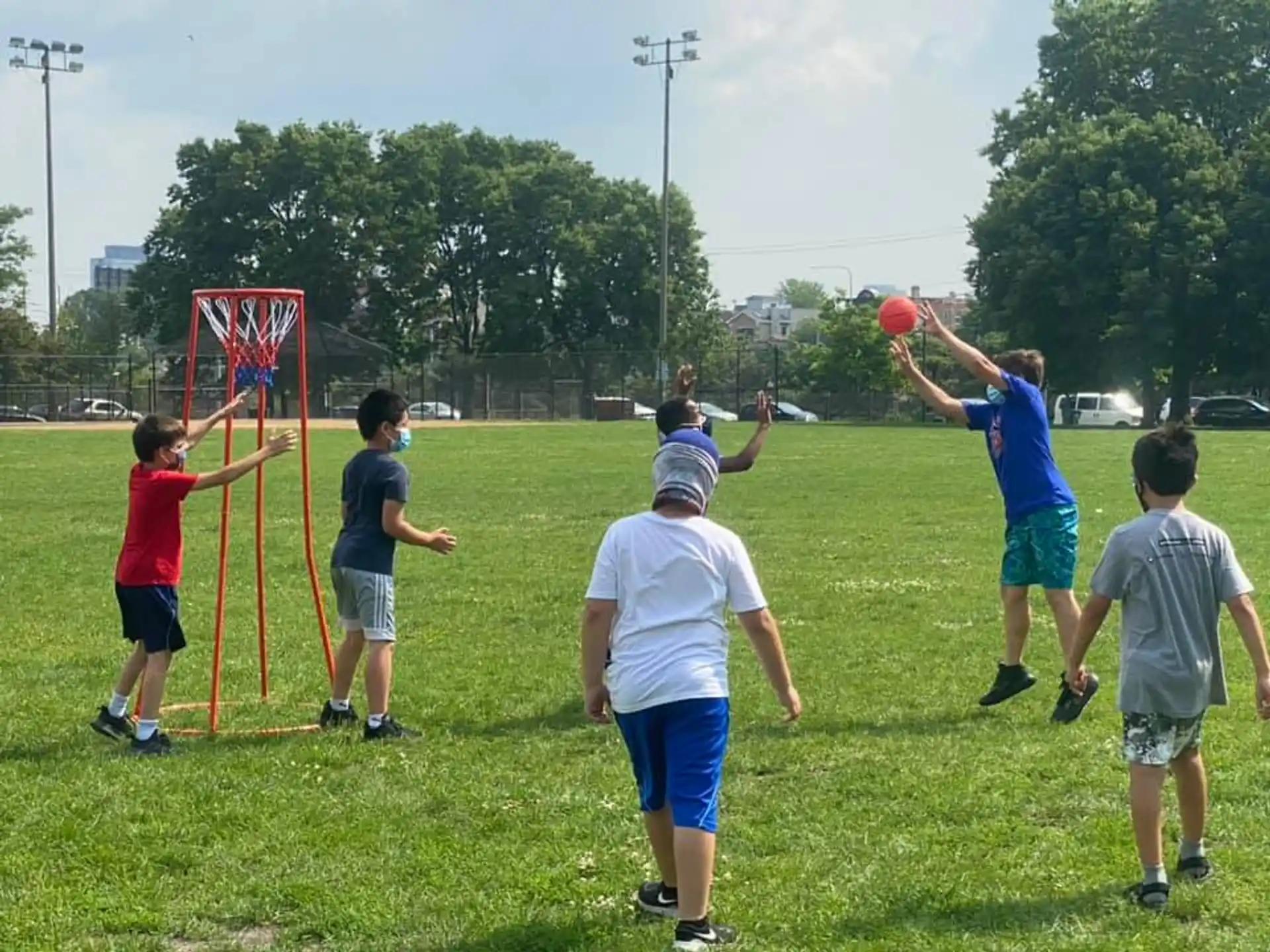 a group of people playing frisbee