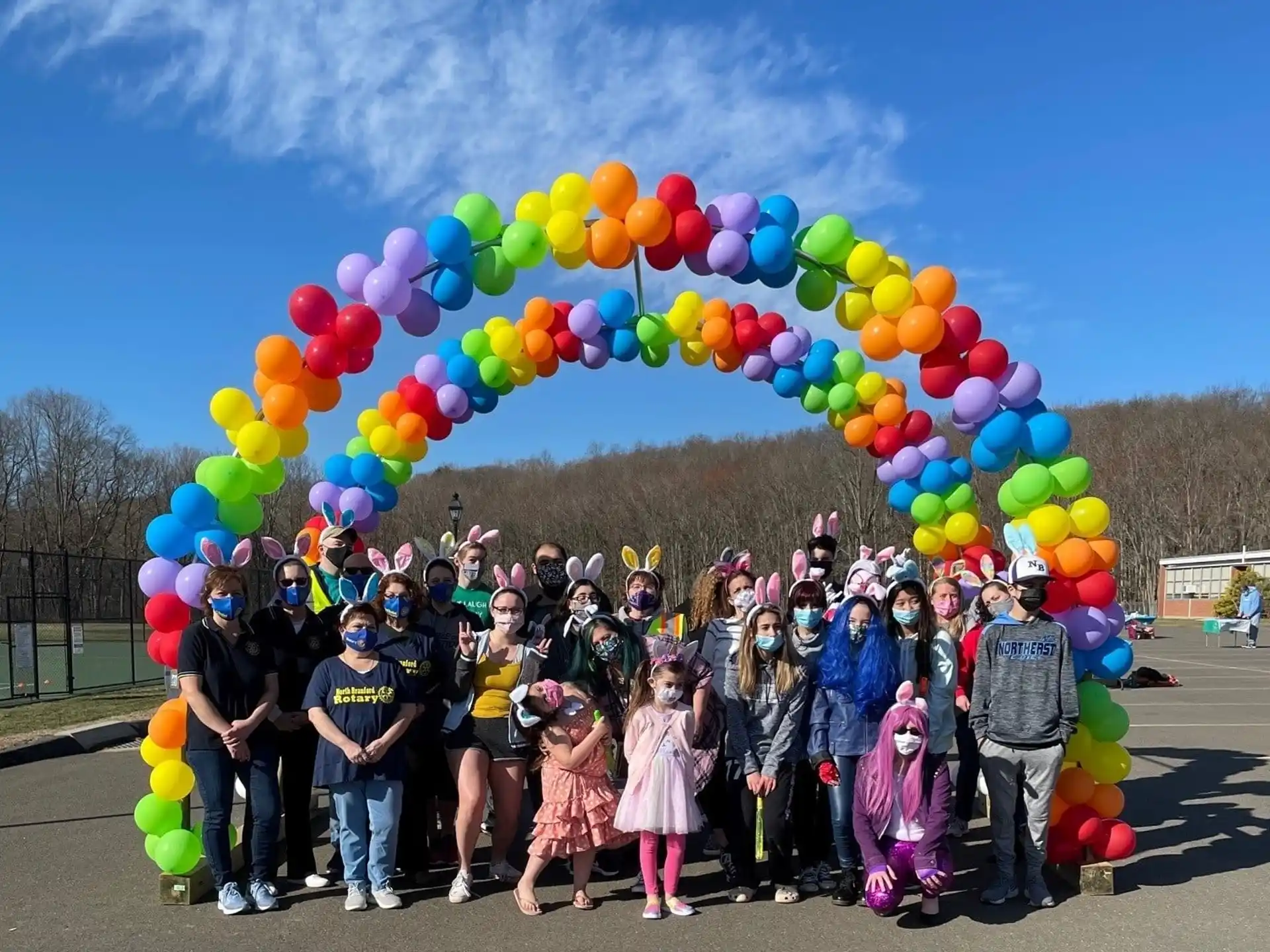 a group of people holding balloons